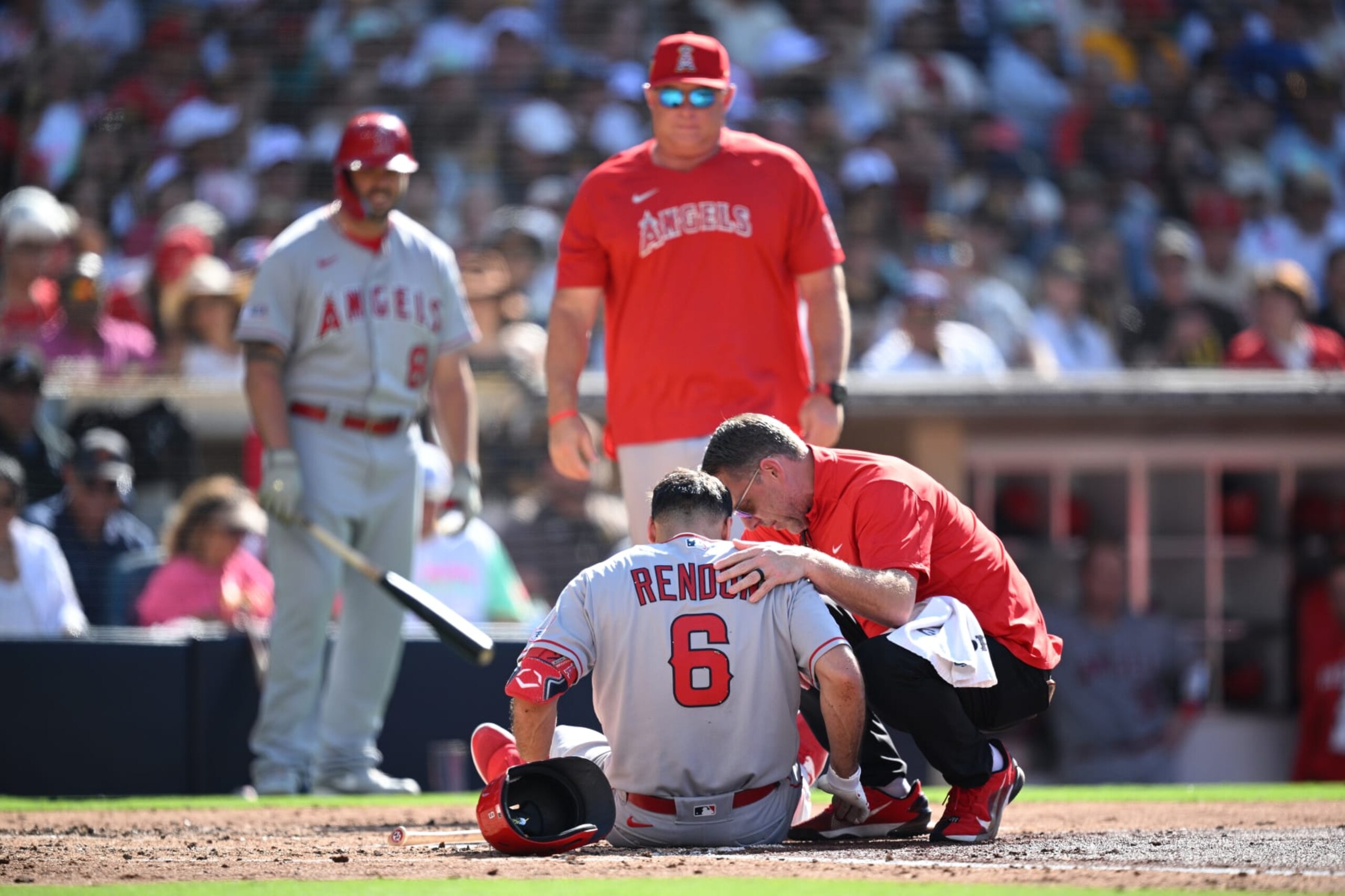 SAN DIEGO, CALIFORNIA - JULY 04: Anthony Rendon #6 of the Los Angeles Angels lays on the field while being checked by a trainer after an injury sustained during the fourth inning against the San Diego Padres at PETCO Park on July 04, 2023 in San Diego, California. (Photo by Orlando Ramirez/Getty Images)