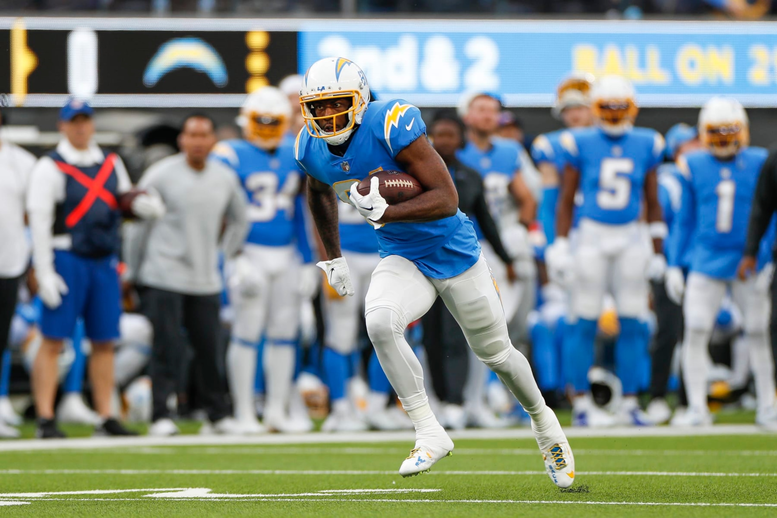 INGLEWOOD, CA - JANUARY 01: Los Angeles Chargers wide receiver Mike Williams (81) runs with the ball during an NFL regular season game between the Los Angeles Rams and the Los Angeles Chargers on January 01, 2023, at SoFi Stadium in Inglewood, CA. (Photo by Brandon Sloter/Icon Sportswire via Getty Images)