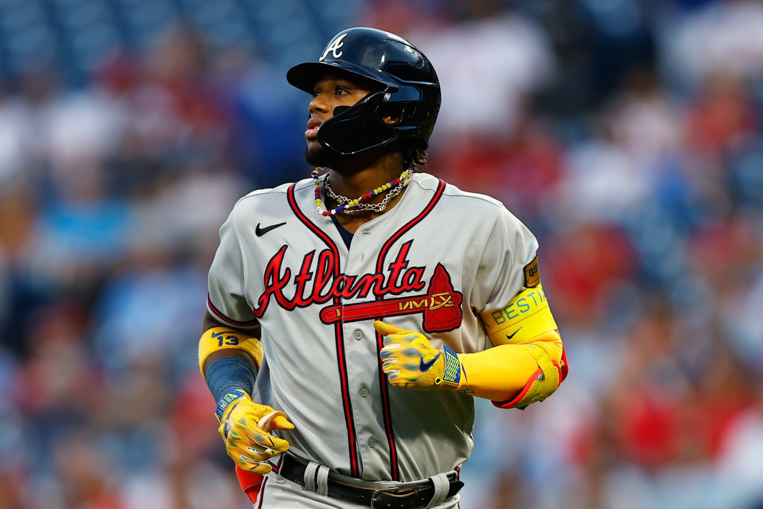 PHILADELPHIA, PA - SEPTEMBER 12:  Ronald Acuna Jr. #13 of the Atlanta Braves goes back to the dugout  during the Major League Baseball game against the Philadelphia Phillies on September 12, 2023 at Citizens Bank Park in Philadelphia, Pennsylvania.  (Photo by Rich Graessle/Icon Sportswire via Getty Images)