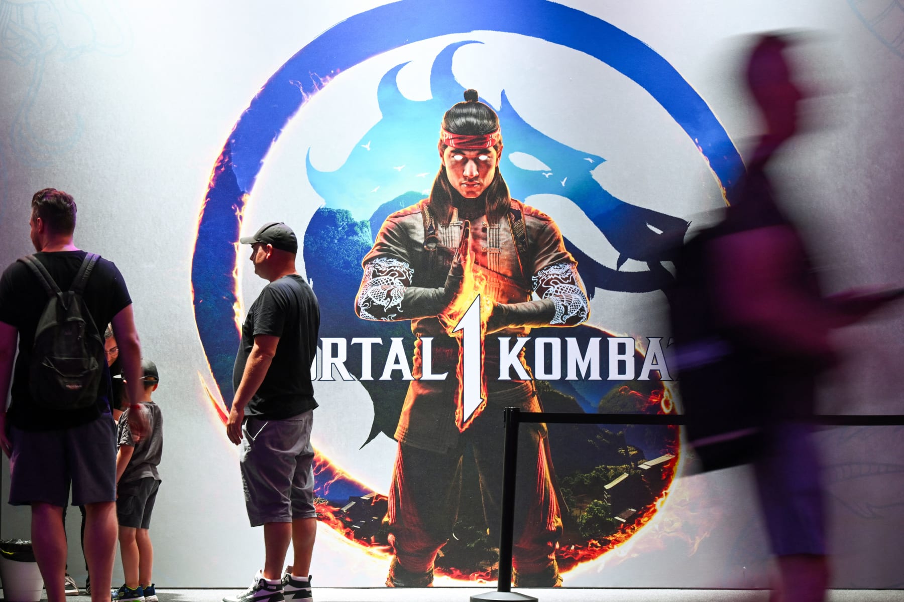 Visitors queue for the Mortal Kombat 1 game at the NetherRealm Studios booth at the Gamescom video game fair in Cologne, western Germany on August 23, 2023. According to the organisers, around 1,100 exhibitors from 53 countries will be presenting their products during the fair running until August 27, 2023. (Photo by Ina FASSBENDER / AFP) (Photo by INA FASSBENDER/AFP via Getty Images)