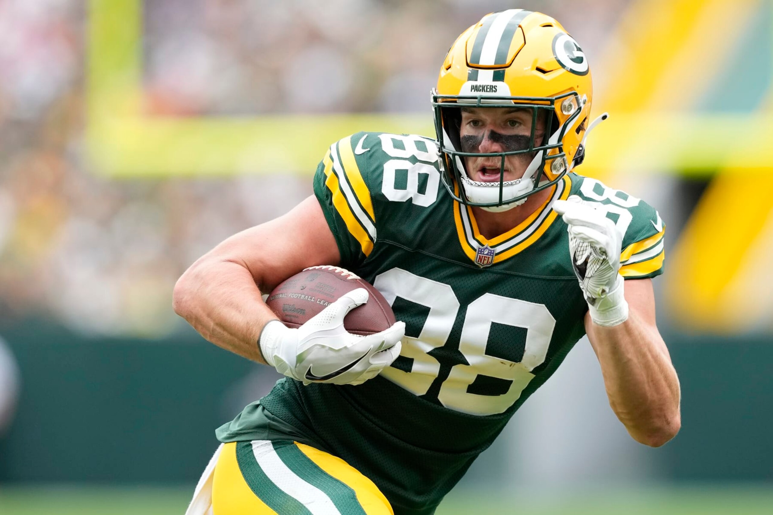 GREEN BAY, WISCONSIN - AUGUST 26: Luke Musgrave #88 of the Green Bay Packers runs with the ball after a catch in the first half against the Seattle Seahawks during a preseason game at Lambeau Field on August 26, 2023 in Green Bay, Wisconsin. (Photo by Patrick McDermott/Getty Images)