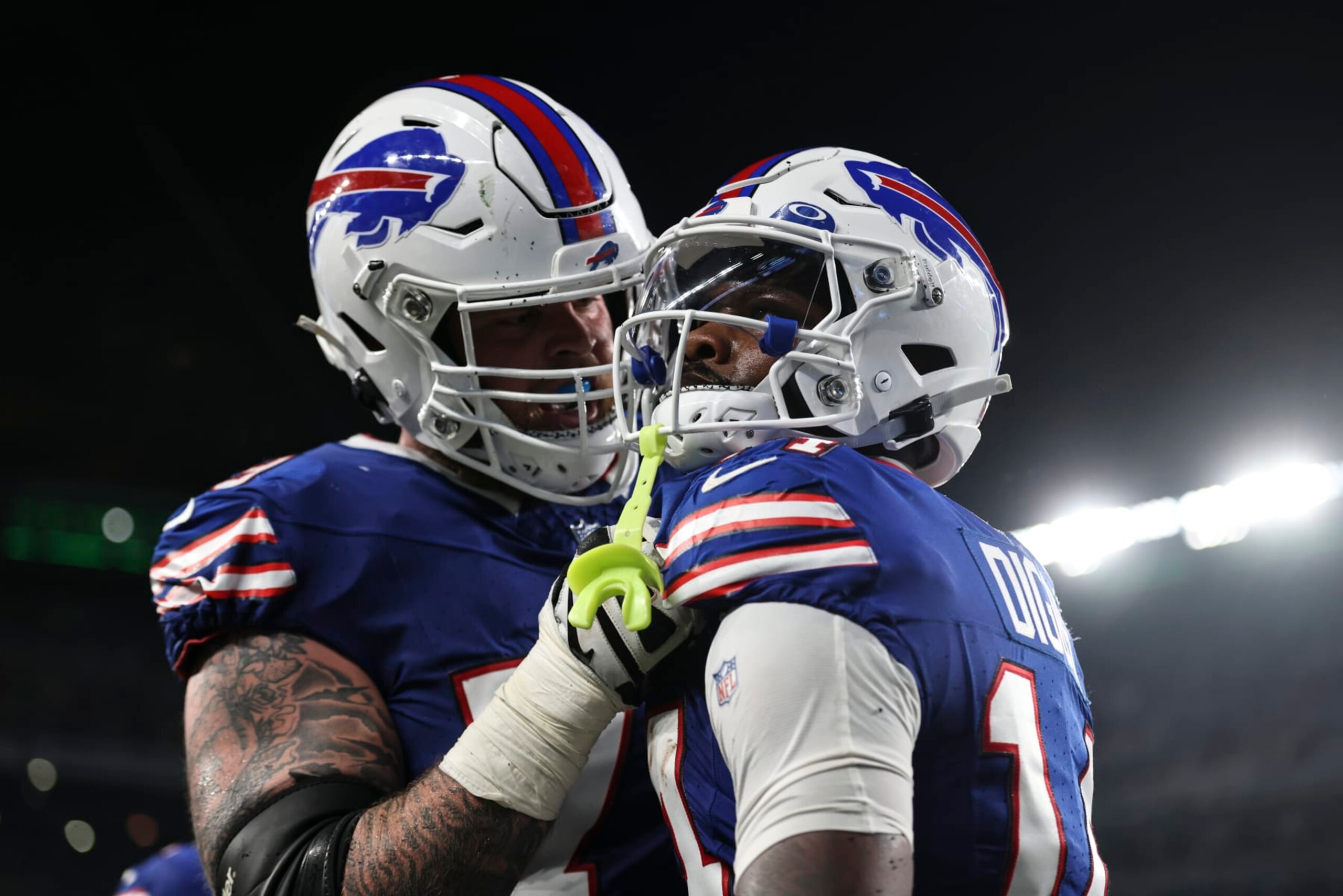 EAST RUTHERFORD, NEW JERSEY - SEPTEMBER 11: Stefon Diggs #14 of the Buffalo Bills celebrates with Spencer Brown #79 of the Buffalo Bills after completing a pass to score a touchdown during a game against the New York Jets at MetLife Stadium on September 11, 2023 in East Rutherford, New Jersey. (Photo by Michael Owens/Getty Images)