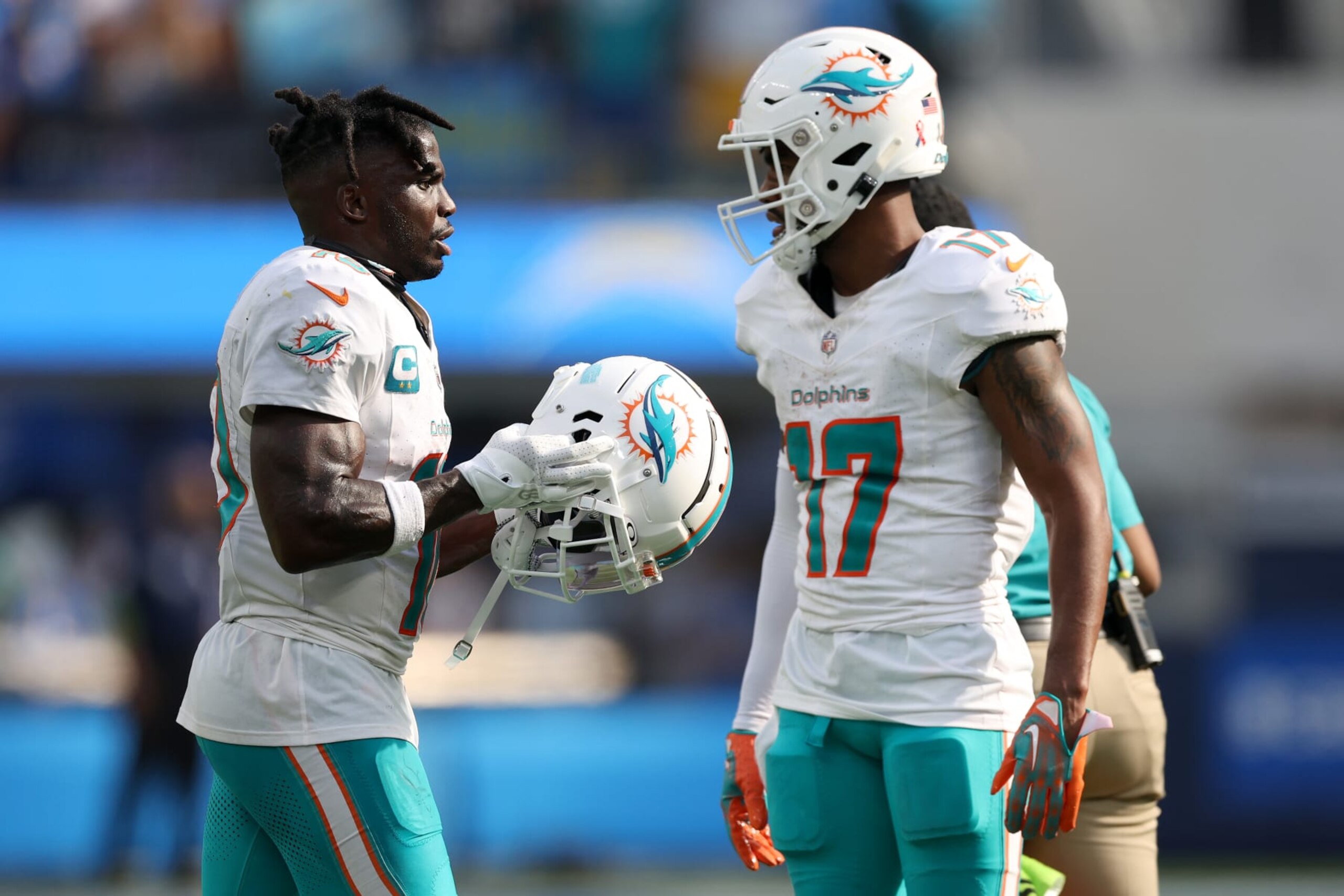 INGLEWOOD, CALIFORNIA - SEPTEMBER 10: Tyreek Hill #10 talks with Jaylen Waddle #17 of the Miami Dolphins after a touchdown in the fourth quarter of a game against the Los Angeles Chargers at SoFi Stadium on September 10, 2023 in Inglewood, California. (Photo by Harry How/Getty Images)