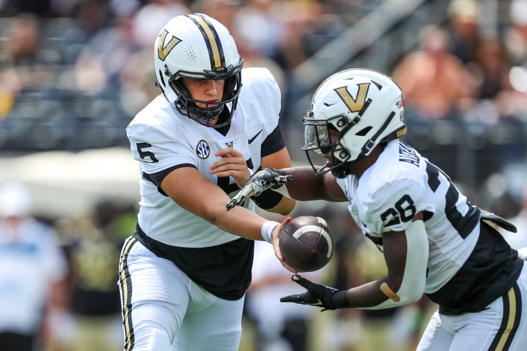 WINSTON-SALEM, NC - SEPTEMBER 09: AJ Swann #5 hands the ball off to Sedrick Alexander #28 of the Vanderbilt Commodores during a football game against the Wake Forest Demon Deacons at Allegacy Federal Credit Union Stadium in Winston-Salem, North Carolina on Sep 9, 2023.  (Photo by David Jensen/Icon Sportswire via Getty Images)