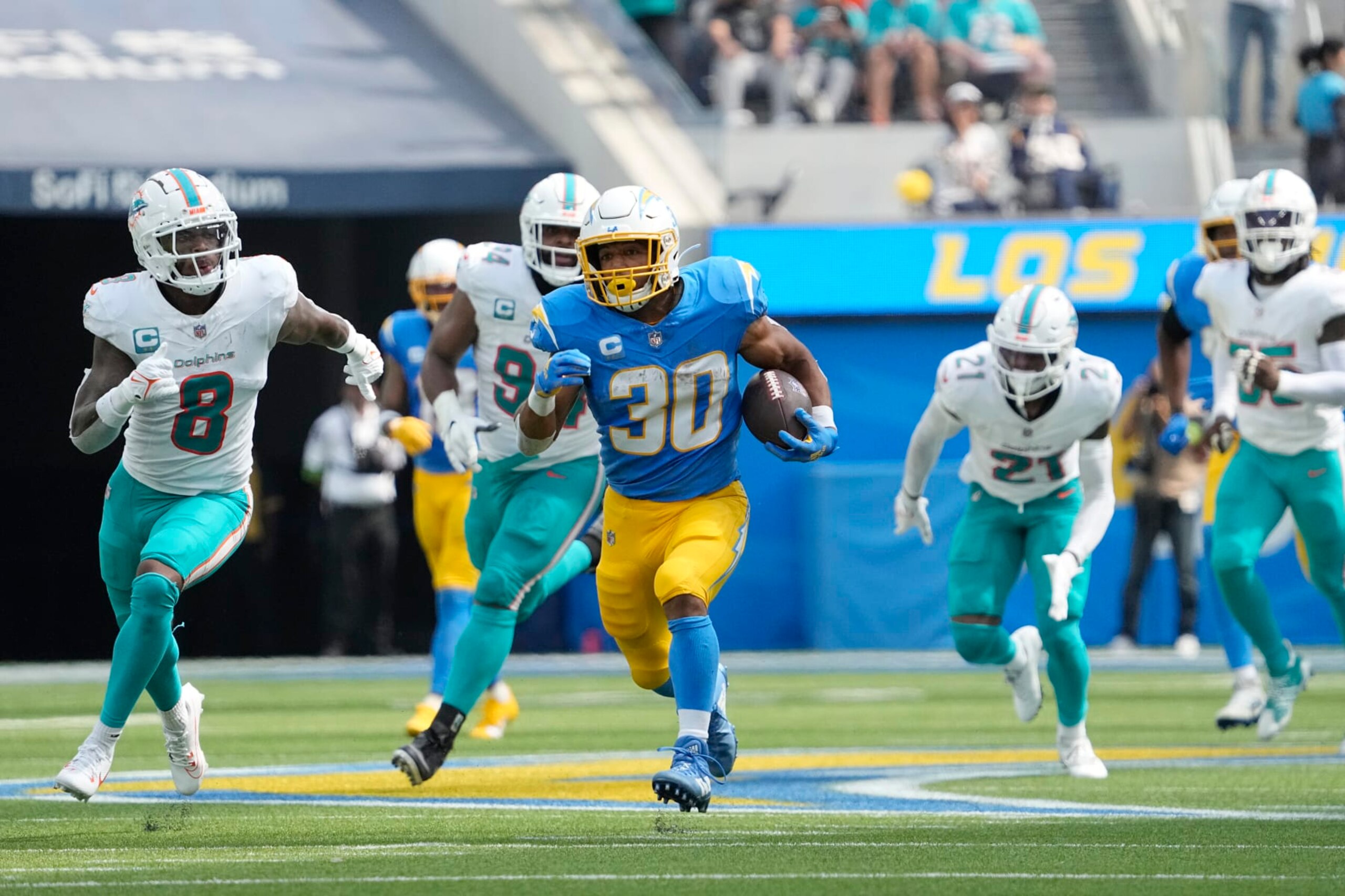 Los Angeles Chargers running back Austin Ekeler (30) runs against the Miami Dolphins during the first half of an NFL football game Sunday, Sept. 10, 2023, in Inglewood, Calif. (AP Photo/Mark J. Terrill) Los Angeles Chargers running back Austin Ekeler (30) runs against the Miami Dolphins during the first half of an NFL football game Sunday, Sept. 10, 2023, in Inglewood, Calif. (AP Photo/Mark J. Terrill)