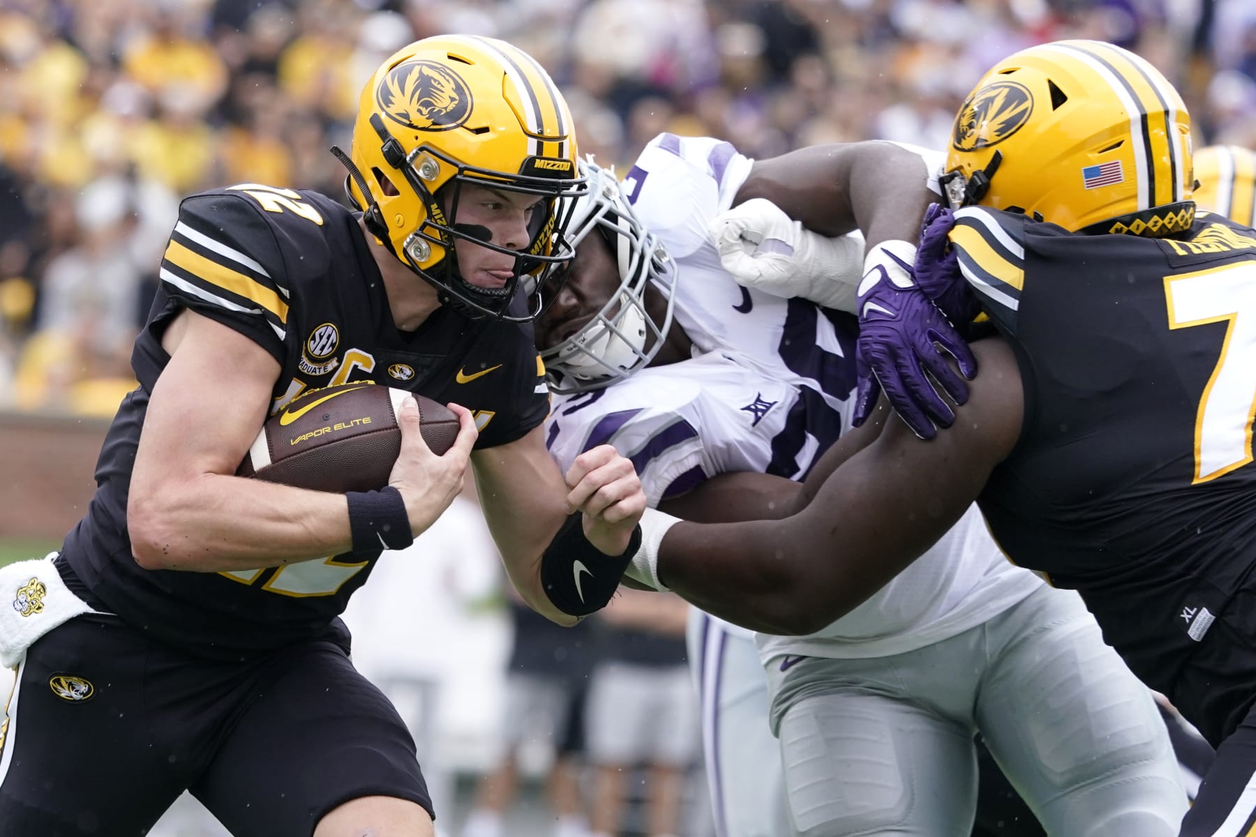 COLUMBIA, MISSOURI - SEPTEMBER 16:  Quarterback Brady Cook #12 of the Missouri Tigers runs against defensive back Phillip Roche #29 of the Missouri Tigers in the first half at Faurot Field/Memorial Stadium on September 16, 2023 in Columbia, Missouri. (Photo by Ed Zurga/Getty Images)