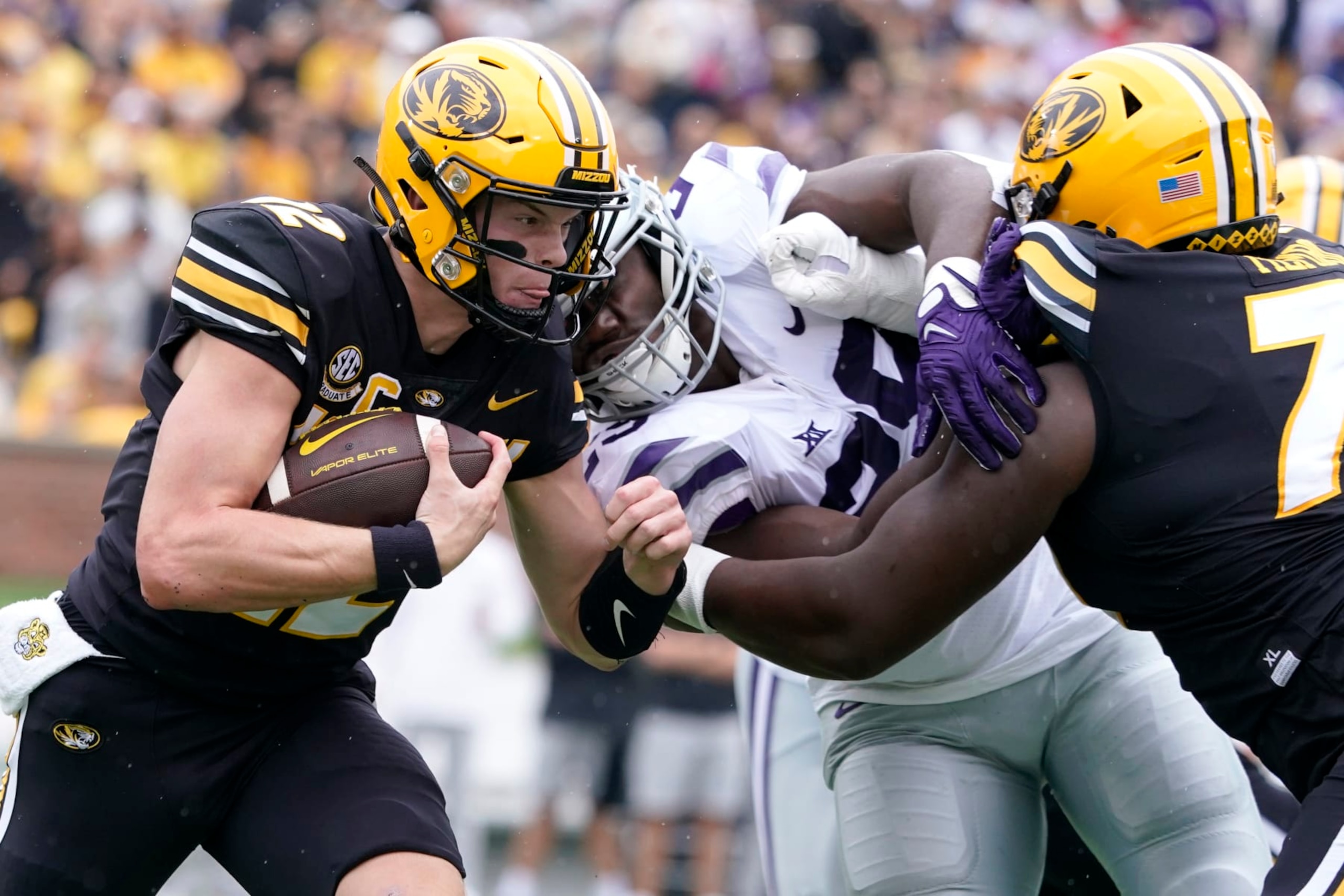 COLUMBIA, MISSOURI - SEPTEMBER 16:  Quarterback Brady Cook #12 of the Missouri Tigers runs against defensive back Phillip Roche #29 of the Missouri Tigers in the first half at Faurot Field/Memorial Stadium on September 16, 2023 in Columbia, Missouri. (Photo by Ed Zurga/Getty Images)