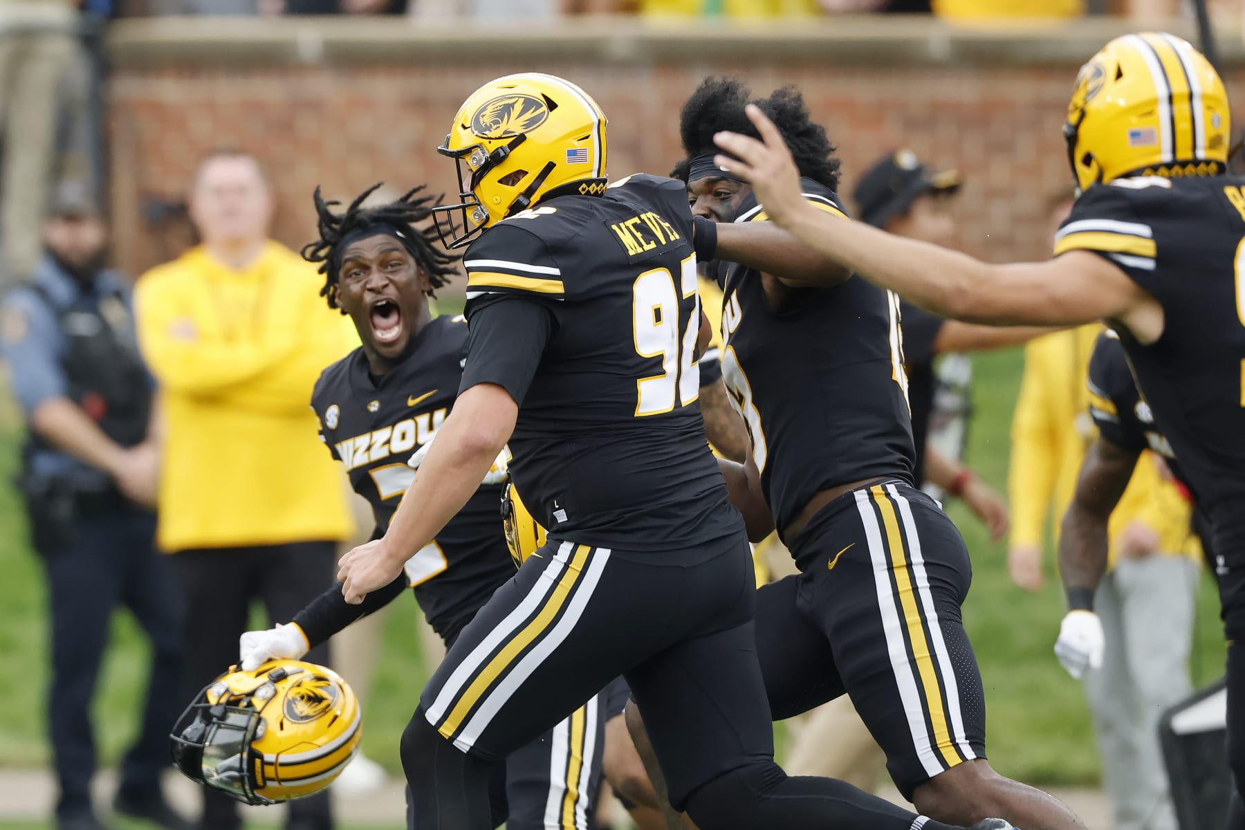 Missouri place kicker Harrison Mevis (92) is congratulated by his teammates after making a 61-yard field goal to win an NCAA football game against Kansas State on Saturday, Sept. 16, 2023 in Columbia, Mo. (AP Photo/Colin E. Braley)