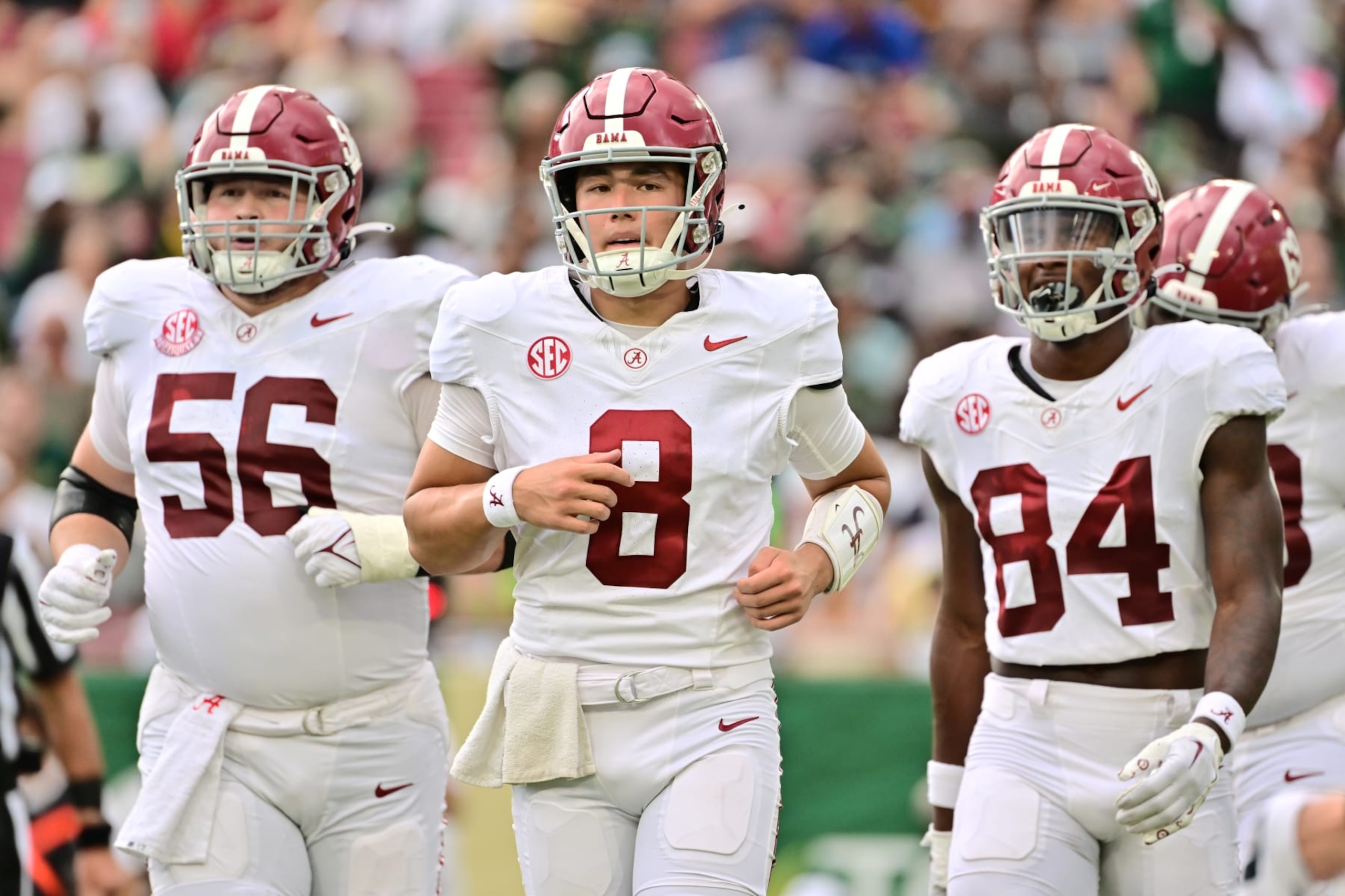 TAMPA, FLORIDA - SEPTEMBER 16: Seth McLaughlin #56, Tyler Buchner #8, and Amari Niblack #84 of the Alabama Crimson Tide run off the field during a timeout in the first quarter against the South Florida Bulls at Raymond James Stadium on September 16, 2023 in Tampa, Florida. (Photo by Julio Aguilar/Getty Images) TAMPA, FLORIDA - SEPTEMBER 16: Seth McLaughlin #56, Tyler Buchner #8, and Amari Niblack #84 of the Alabama Crimson Tide run off the field during a timeout in the first quarter against the South Florida Bulls at Raymond James Stadium on September 16, 2023 in Tampa, Florida. (Photo by Julio Aguilar/Getty Images)