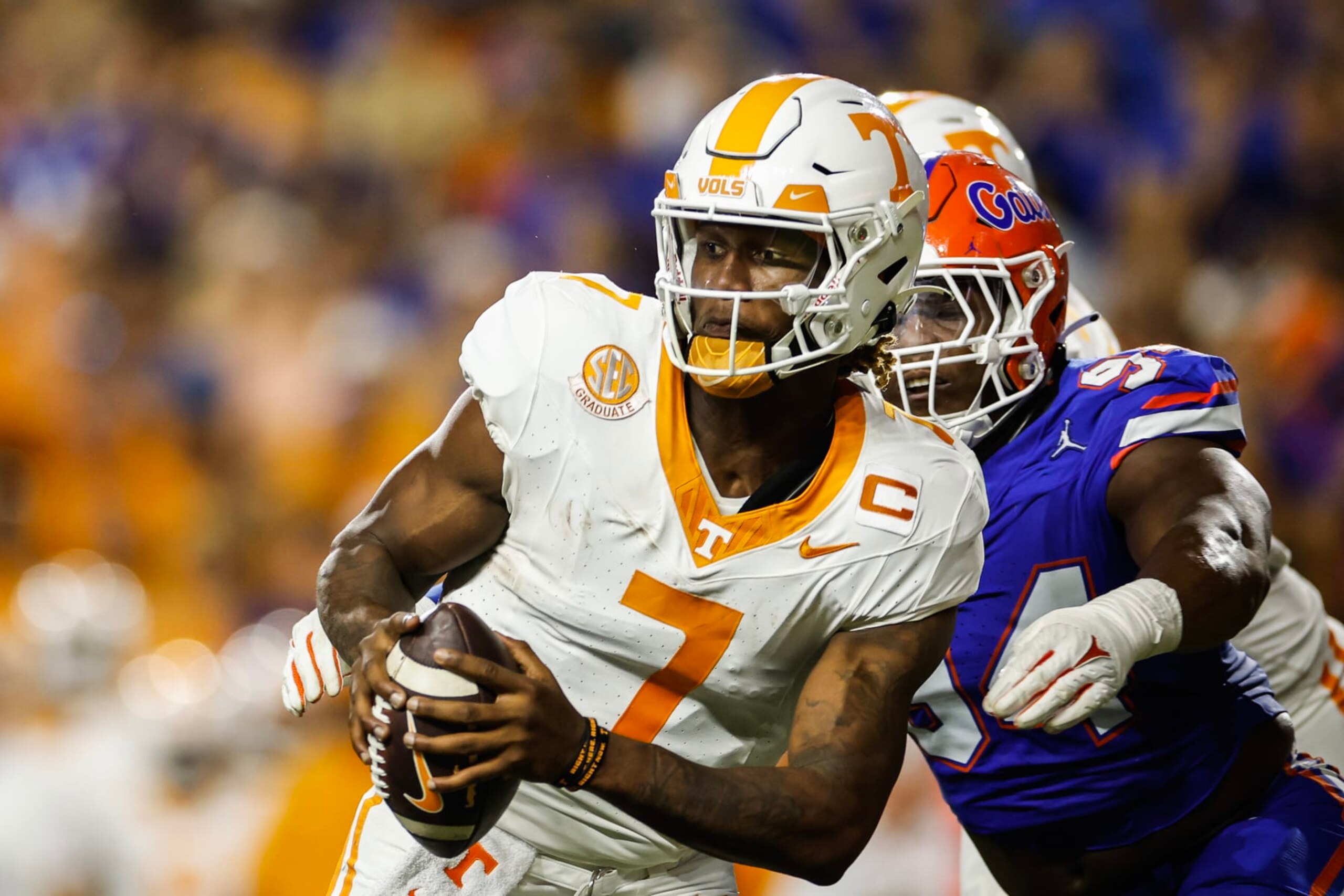 GAINESVILLE, FLORIDA - SEPTEMBER 16: Joe Milton III #7 of the Tennessee Volunteers is sacked by Tyreak Sapp #94 of the Florida Gators during the first half of a game at Ben Hill Griffin Stadium on September 16, 2023 in Gainesville, Florida. (Photo by James Gilbert/Getty Images)
