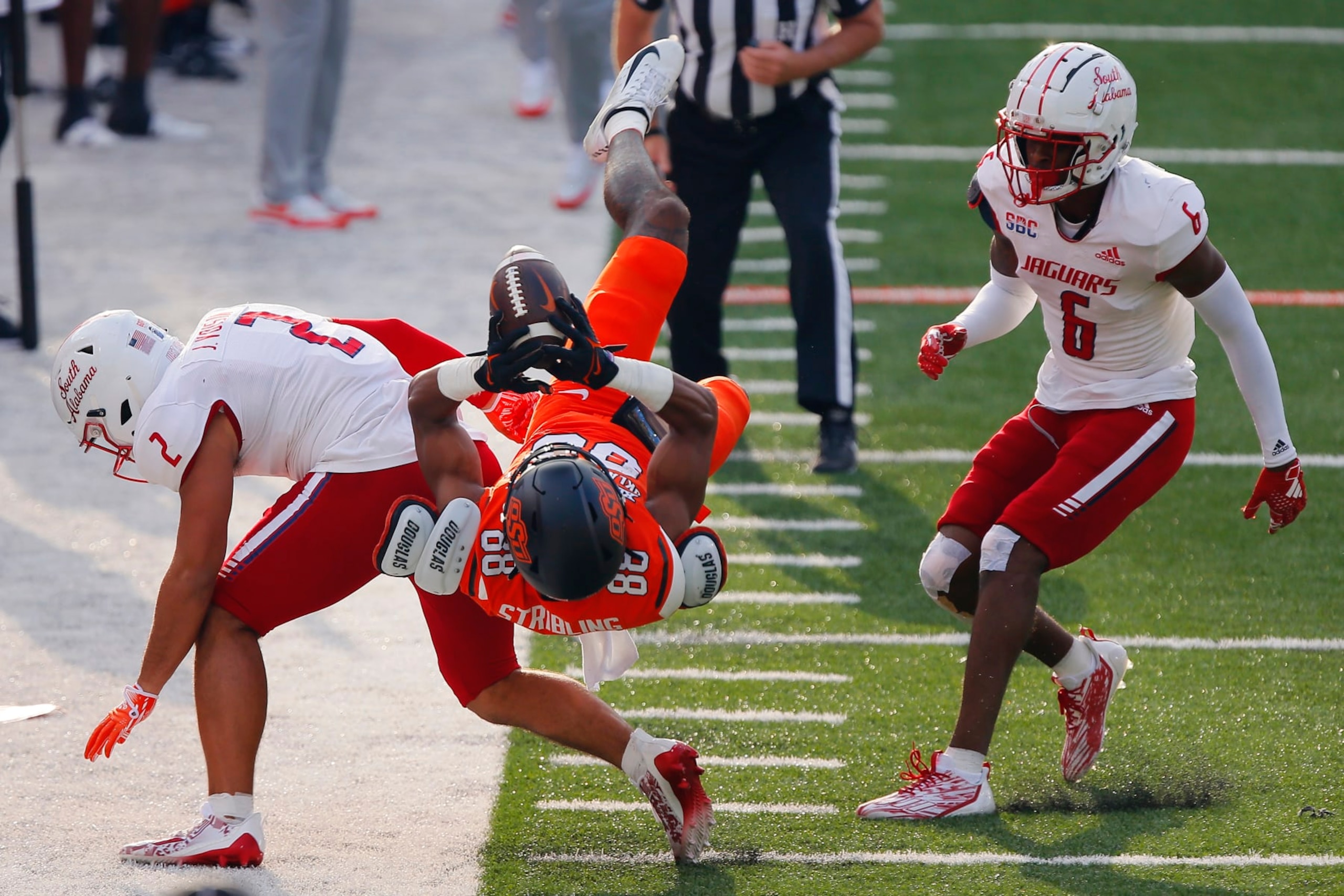 STILLWATER, OK - SEPTEMBER 16: Wide receiver De'Zhaun Stribling #88 of the Oklahoma State Cowboys fails to land in bounds for a catch against safety Jaden Voisin #2 and cornerback Ricky Fletcher #6 of the South Alabama Jaguars in the first quarter at Boone Pickens Stadium on September 16, 2023 in Stillwater, Oklahoma. (Photo by Brian Bahr/Getty Images) STILLWATER, OK - SEPTEMBER 16: Wide receiver De'Zhaun Stribling #88 of the Oklahoma State Cowboys fails to land in bounds for a catch against safety Jaden Voisin #2 and cornerback Ricky Fletcher #6 of the South Alabama Jaguars in the first quarter at Boone Pickens Stadium on September 16, 2023 in Stillwater, Oklahoma. (Photo by Brian Bahr/Getty Images)