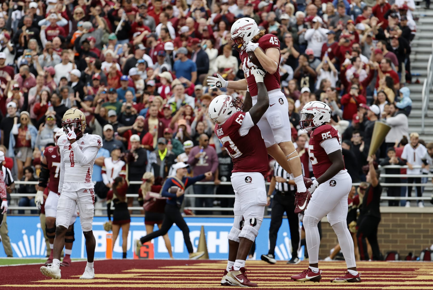 CHESTNUT HILL, MA - SEPTEMBER 16: Florida State Seminoles tight end Preston Daniel (45) is hoisted into the air by Florida State Seminoles offensive lineman Jeremiah Byers (63) after scoring during a game between the Boston College Eagles and the Florida State Seminoles on September 16, 2023, at Alumni Stadium in Chestnut Hill, Massachusetts. (Photo by Fred Kfoury III/Icon Sportswire via Getty Images)