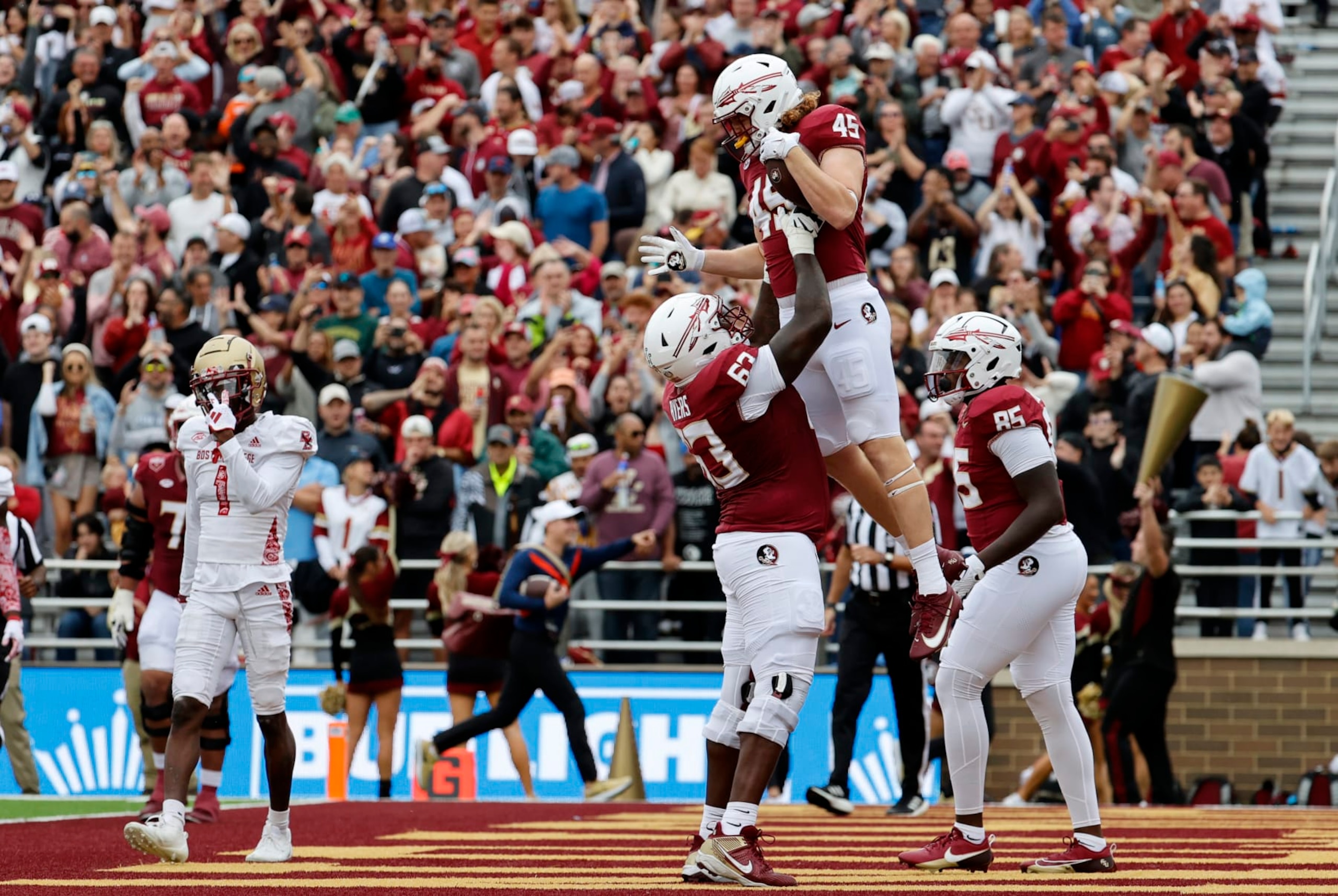 CHESTNUT HILL, MA - SEPTEMBER 16: Florida State Seminoles tight end Preston Daniel (45) is hoisted into the air by Florida State Seminoles offensive lineman Jeremiah Byers (63) after scoring during a game between the Boston College Eagles and the Florida State Seminoles on September 16, 2023, at Alumni Stadium in Chestnut Hill, Massachusetts. (Photo by Fred Kfoury III/Icon Sportswire via Getty Images)