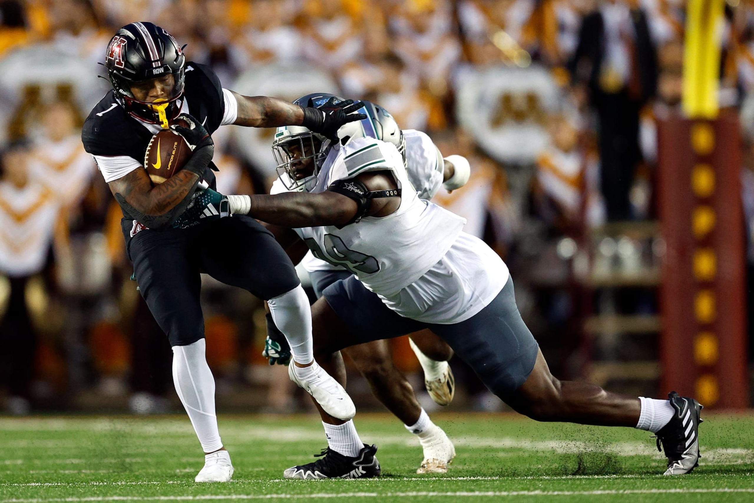 MINNEAPOLIS, MINNESOTA - SEPTEMBER 09: Darius Taylor #1 of the Minnesota Golden Gophers is tackled by Melvin Swindle II #99 of the Eastern Michigan Eagles in the first half at Huntington Bank Stadium on September 09, 2023 in Minneapolis, Minnesota. (Photo by David Berding/Getty Images) MINNEAPOLIS, MINNESOTA - SEPTEMBER 09: Darius Taylor #1 of the Minnesota Golden Gophers is tackled by Melvin Swindle II #99 of the Eastern Michigan Eagles in the first half at Huntington Bank Stadium on September 09, 2023 in Minneapolis, Minnesota. (Photo by David Berding/Getty Images)