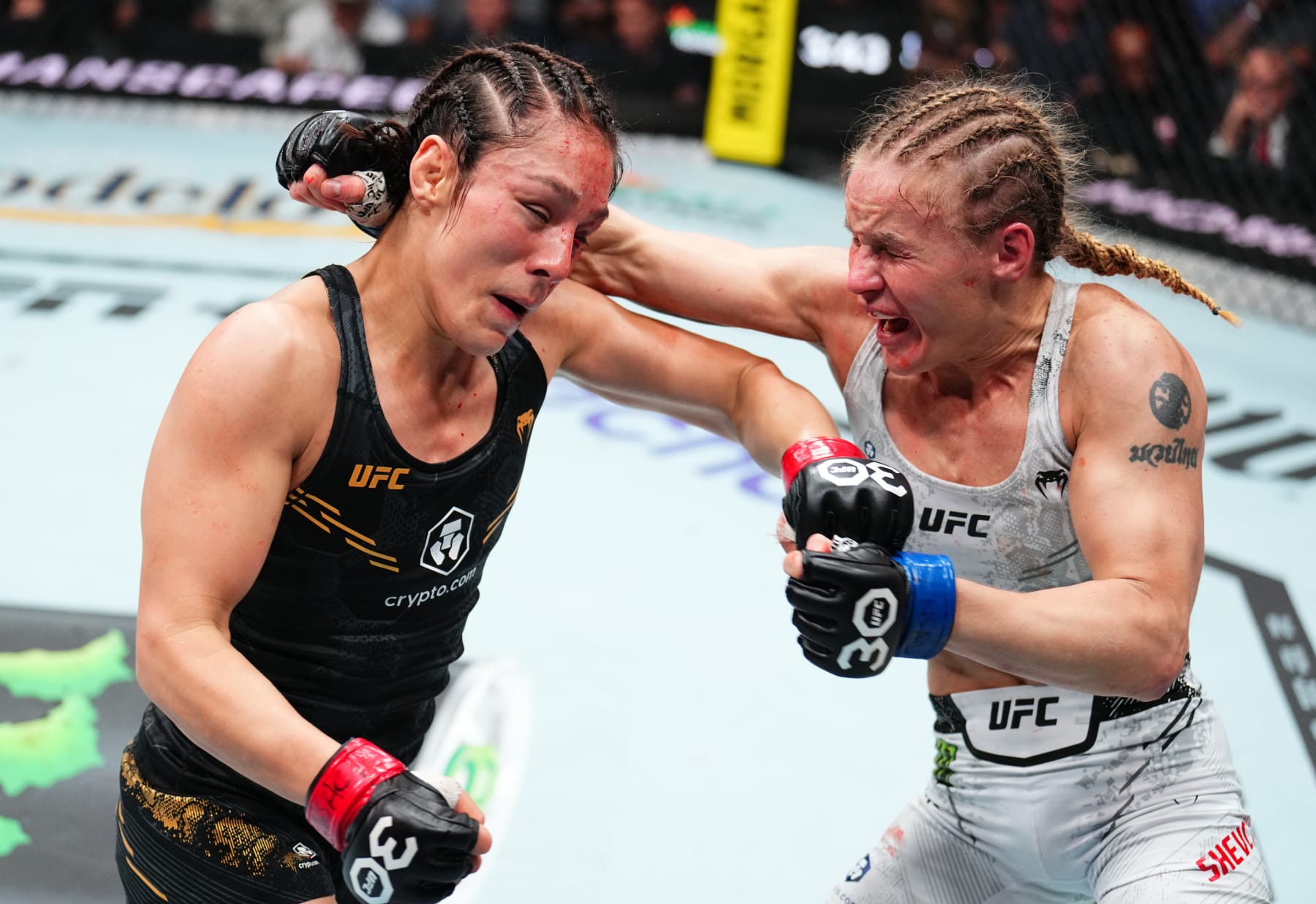LAS VEGAS, NEVADA - SEPTEMBER 16: (R-L) Valentina Shevchenko of Kyrgyzstan and Alexa Grasso of Mexico trade punches in the UFC flyweight championship fight during the Noche UFC event at T-Mobile Arena on September 16, 2023 in Las Vegas, Nevada. (Photo by Chris Unger/Zuffa LLC via Getty Images)
