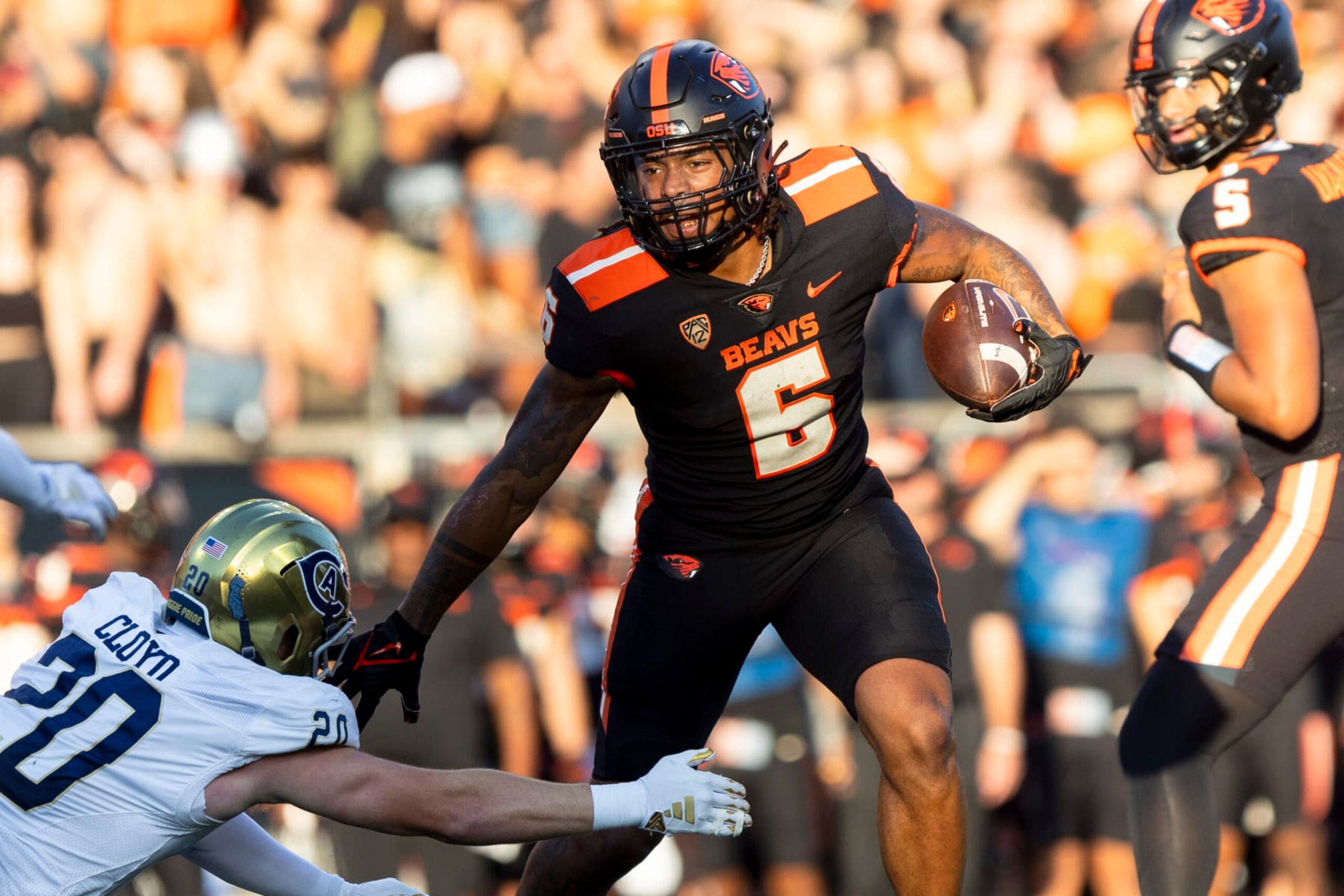 CORVALLIS, OR - SEPTEMBER 09: UC Davis Aggies linebacker Jackson Cloyd (20) attempts to tackle Oregon State Beavers running back Damien Martinez (6) during a college football game between the UC Davis Aggies and Oregon State Beavers on September, 9, 2023 at Reser Stadium in Corvallis, OR. (Logan Hannigan-Downs/Icon Sportswire via Getty Images) CORVALLIS, OR - SEPTEMBER 09: UC Davis Aggies linebacker Jackson Cloyd (20) attempts to tackle Oregon State Beavers running back Damien Martinez (6) during a college football game between the UC Davis Aggies and Oregon State Beavers on September, 9, 2023 at Reser Stadium in Corvallis, OR. (Logan Hannigan-Downs/Icon Sportswire via Getty Images)