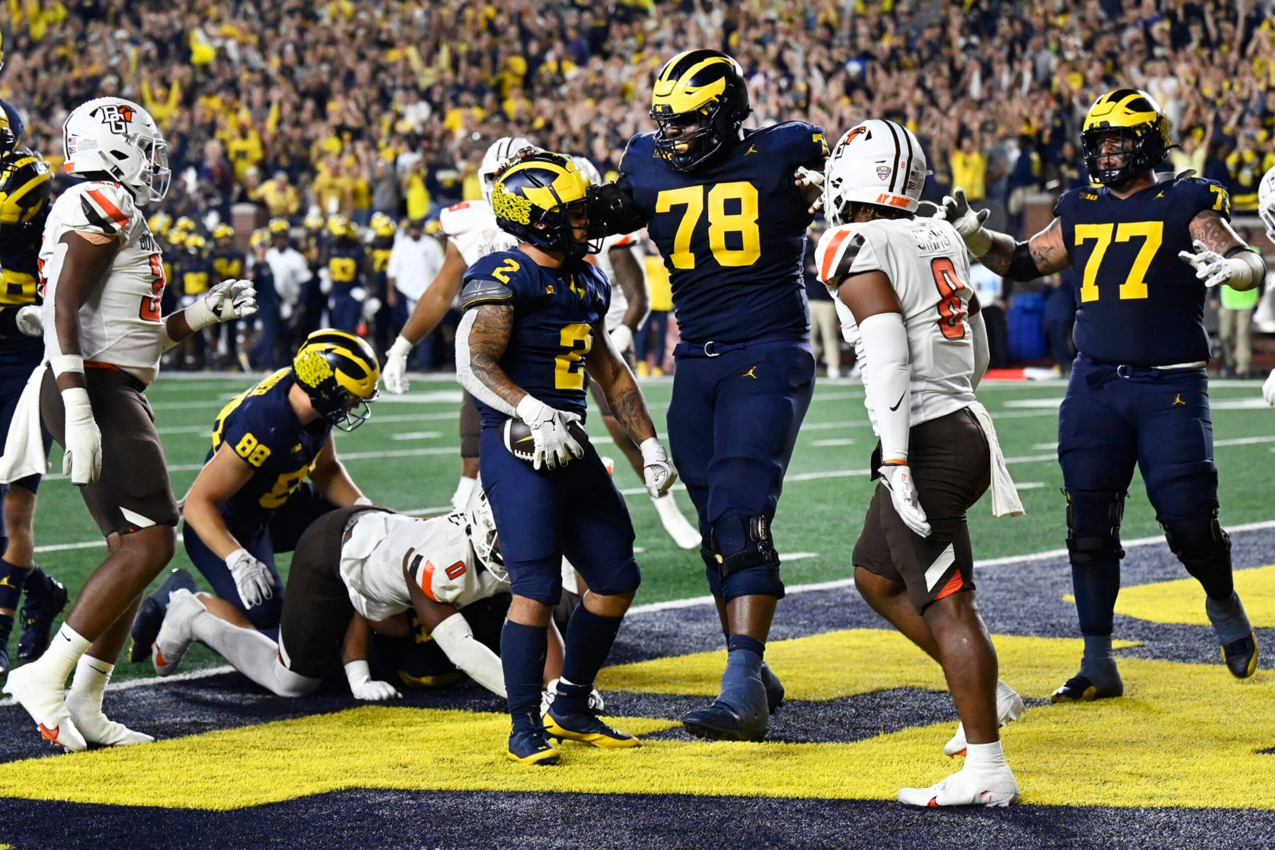 Michigan running back Blake Corum (2) is congratulated by offensive lineman Myles Hinton (78) after scoring a touchdown in the second half of an NCAA college football game against Bowling Green, Saturday, Sept. 16, 2023, in Ann Arbor, Mich. (AP Photo/Jose Juarez) Michigan running back Blake Corum (2) is congratulated by offensive lineman Myles Hinton (78) after scoring a touchdown in the second half of an NCAA college football game against Bowling Green, Saturday, Sept. 16, 2023, in Ann Arbor, Mich. (AP Photo/Jose Juarez)