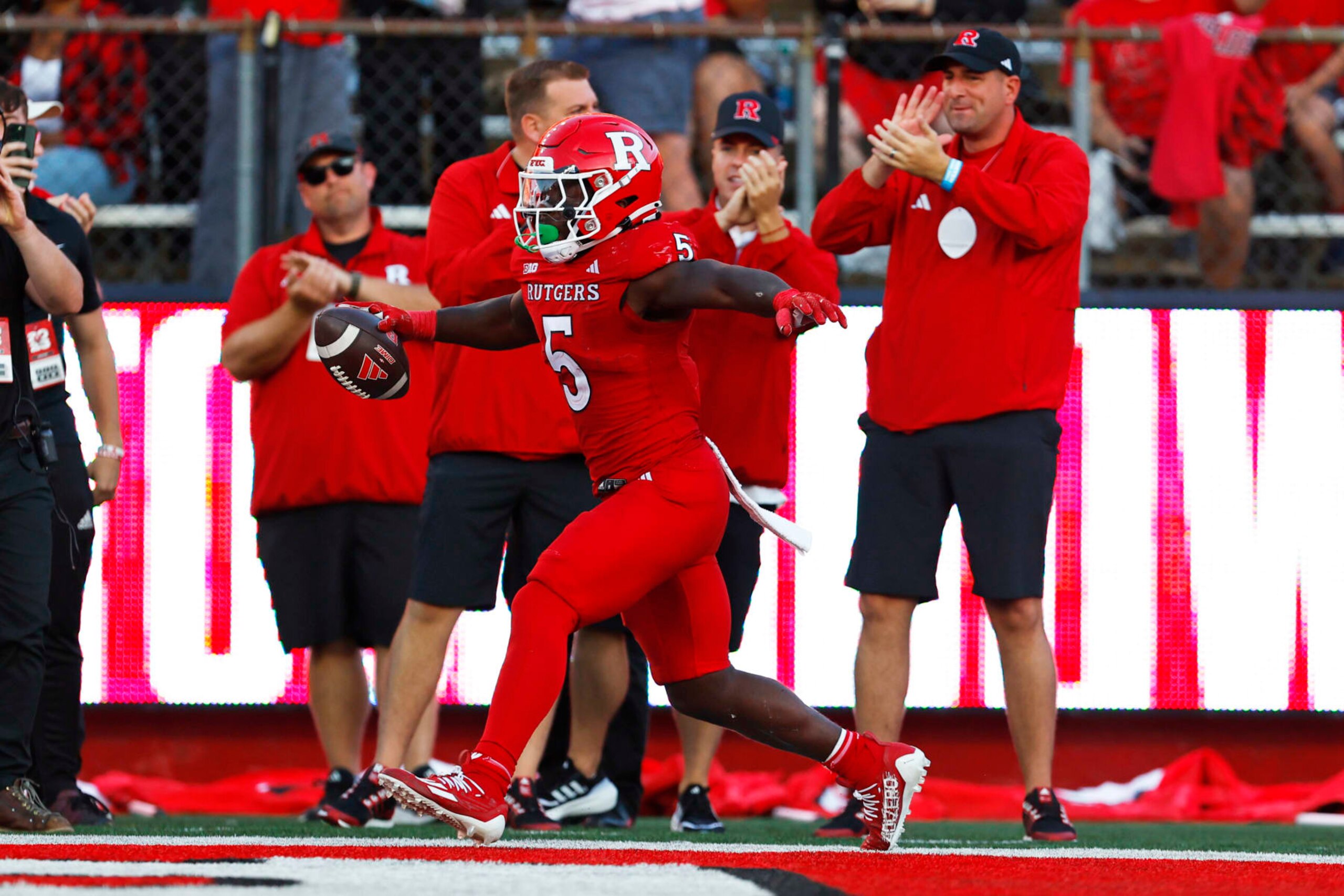 PISCATAWAY, NEW JERSEY - SEPTEMBER 16: Running back Kyle Monangai #5 of the Rutgers Scarlet Knights celebrates his touchdown against the Virginia Tech Hokies during the fourth quarter of a college football game at SHI Stadium on September 16, 2023 in Piscataway, New Jersey. Rutgers defeated Virginia Tech 35-16. (Photo by Rich Schultz/Getty Images) PISCATAWAY, NEW JERSEY - SEPTEMBER 16: Running back Kyle Monangai #5 of the Rutgers Scarlet Knights celebrates his touchdown against the Virginia Tech Hokies during the fourth quarter of a college football game at SHI Stadium on September 16, 2023 in Piscataway, New Jersey. Rutgers defeated Virginia Tech 35-16. (Photo by Rich Schultz/Getty Images)