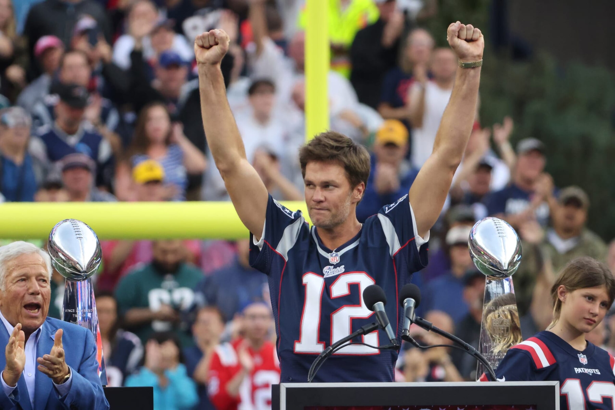 Foxborough, MA - September 10: Former New England Patriots QB Tom Brady raises his arms triumphantly during a halftime ceremony honoring him. The Patriots lost to the Philadelphia Eagles, 25-20. (Photo by Matthew J. Lee/The Boston Globe via Getty Images)