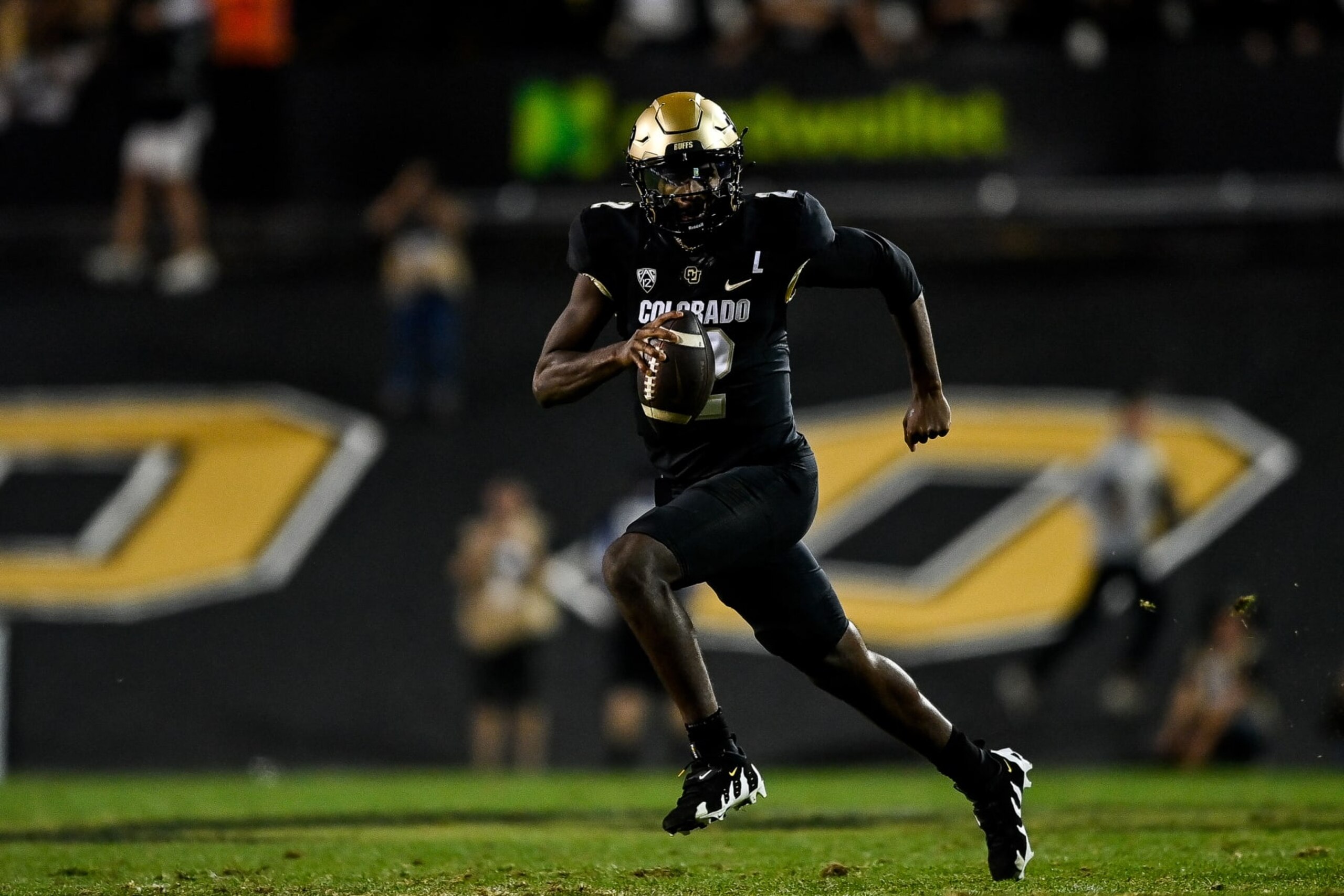 BOULDER, CO - SEPTEMBER 16:  Quarterback Shedeur Sanders #2 of the Colorado Buffaloes scrambles in the fourth quarter against the Colorado State Rams at Folsom Field on September 16, 2023 in Boulder, Colorado. (Photo by Dustin Bradford/Getty Images)