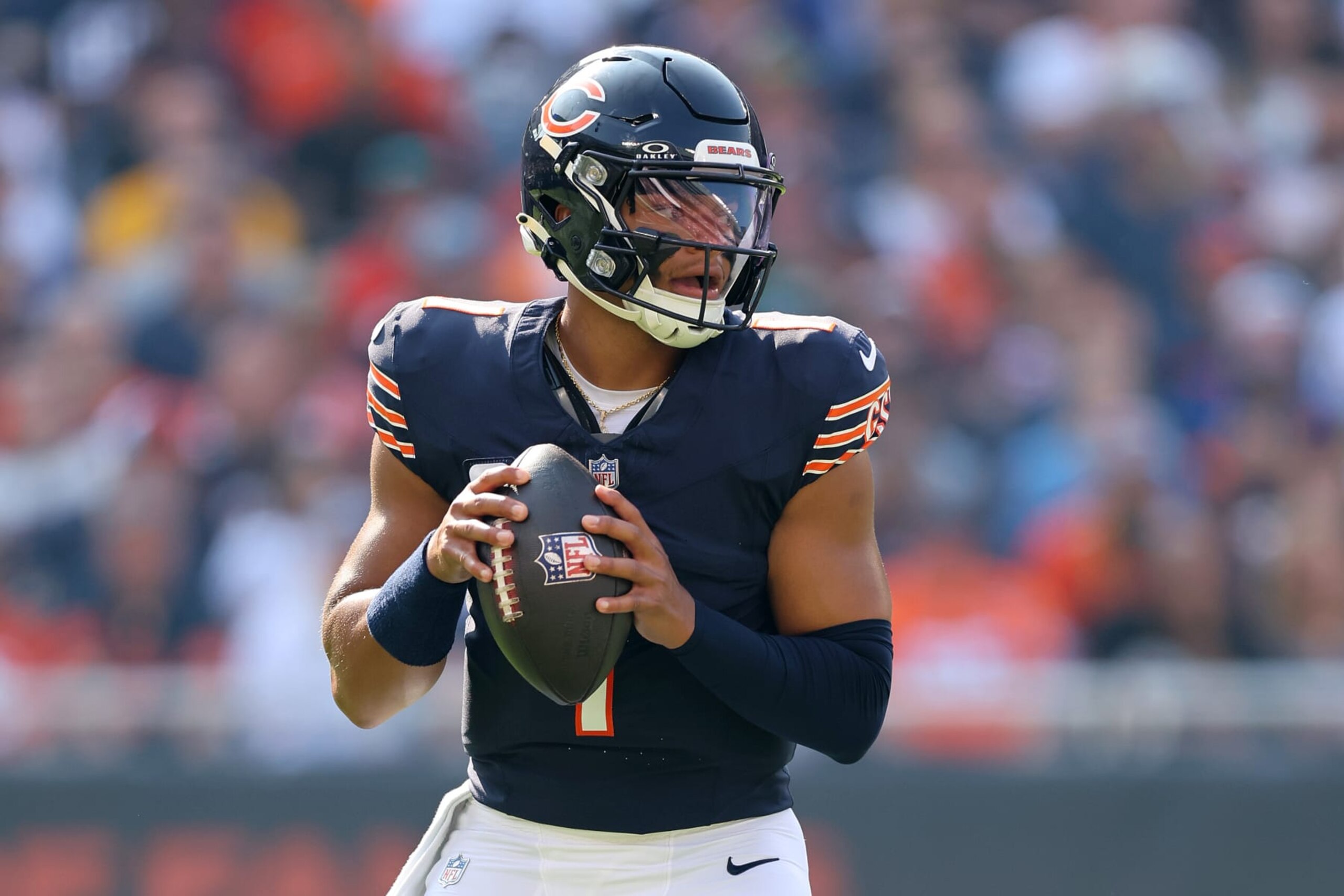 CHICAGO, ILLINOIS - SEPTEMBER 10: Justin Fields #1 of the Chicago Bears looks to pass against the Green Bay Packers at Soldier Field on September 10, 2023 in Chicago, Illinois. (Photo by Michael Reaves/Getty Images)