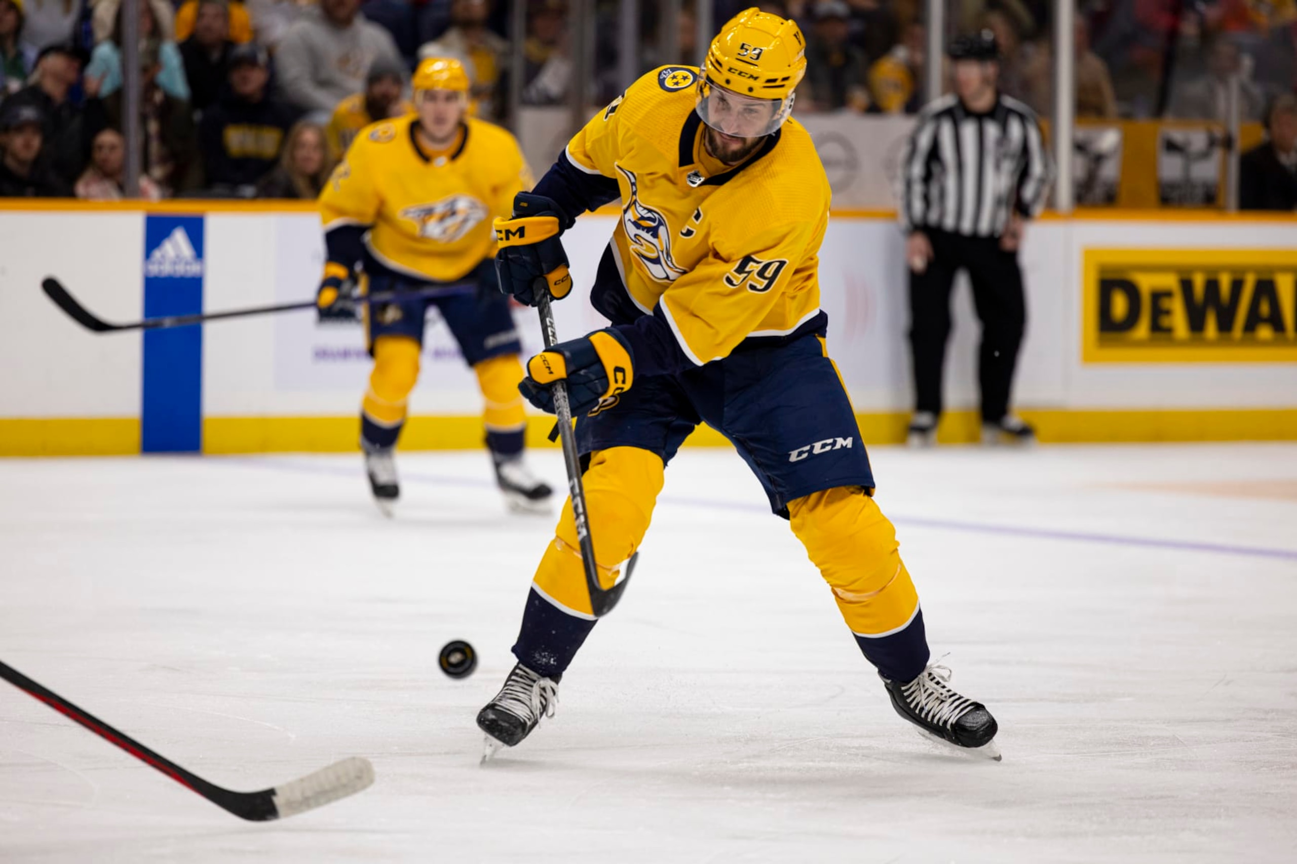 NASHVILLE, TN - MARCH 14:  Roman Josi #59 of the Nashville Predators passes the puck during the first period against the Detroit Red Wings at Bridgestone Arena on March 14, 2023 in Nashville, Tennessee. (Photo by Brett Carlsen/Getty Images)
