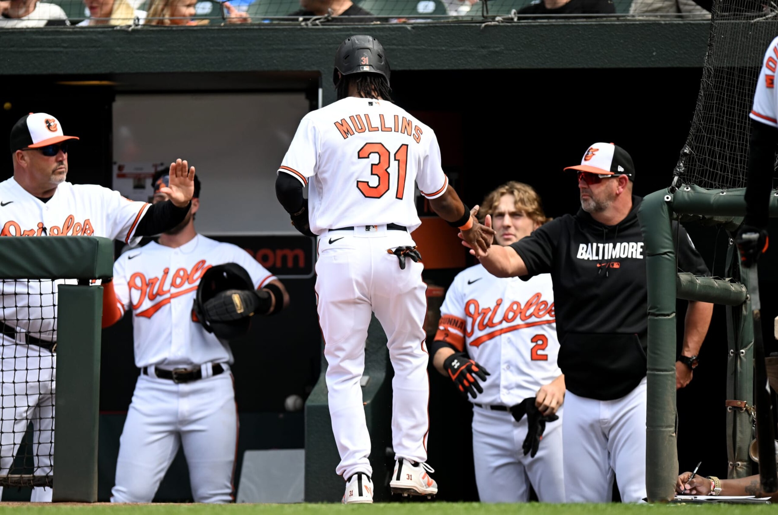 BALTIMORE, MARYLAND - MAY 28: Cedric Mullins #31 of the Baltimore Orioles celebrates with manager Brandon Hyde #18 after scoring in the eighth inning against the Texas Rangers at Oriole Park at Camden Yards on May 28, 2023 in Baltimore, Maryland. (Photo by Greg Fiume/Getty Images)