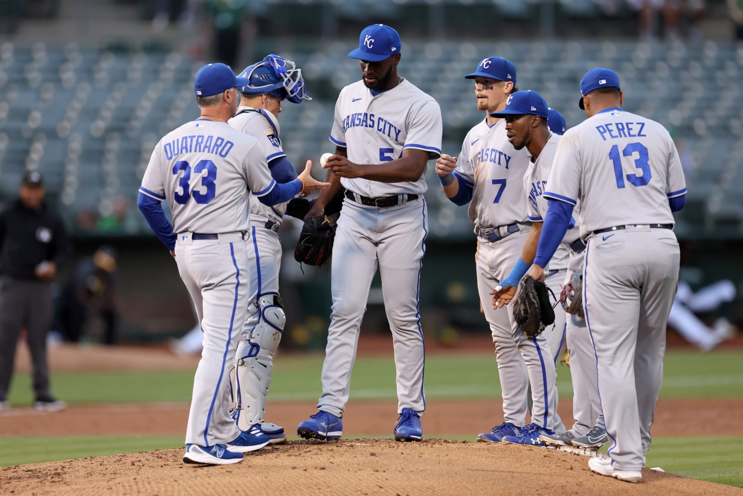 OAKLAND, CALIFORNIA - AUGUST 21: Taylor Hearn #54 of the Kansas City Royals is taken out of the game by Matt Quatraro #33 in the second inning of their game against the Oakland Athletics at RingCentral Coliseum on August 21, 2023 in Oakland, California. (Photo by Ezra Shaw/Getty Images)
