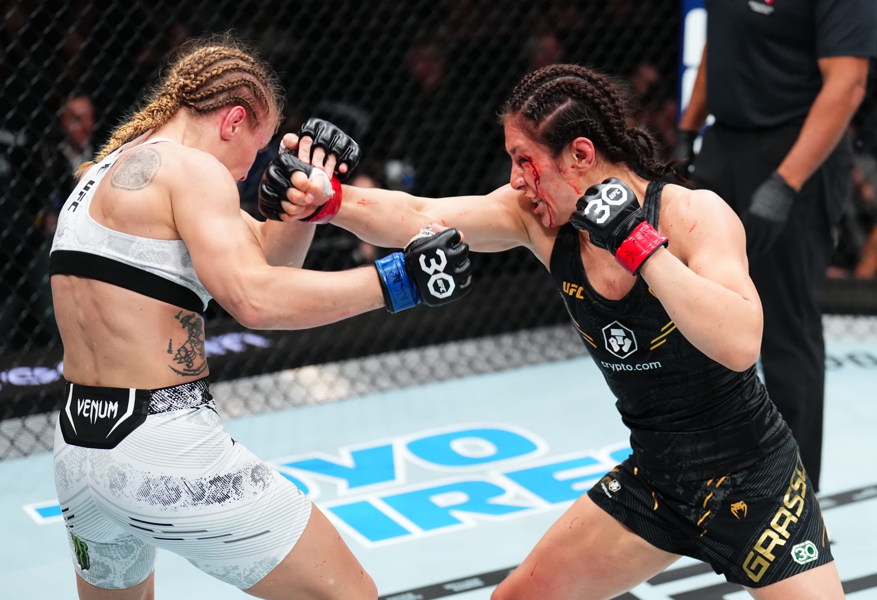 LAS VEGAS, NEVADA - SEPTEMBER 16: (R-L) Alexa Grasso of Mexico punches Valentina Shevchenko of Kyrgyzstan in the UFC flyweight championship fight during the Noche UFC event at T-Mobile Arena on September 16, 2023 in Las Vegas, Nevada. (Photo by Chris Unger/Zuffa LLC via Getty Images)