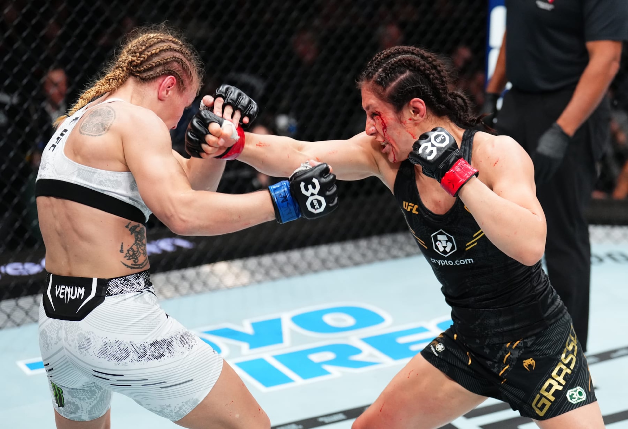 LAS VEGAS, NEVADA - SEPTEMBER 16: (R-L) Alexa Grasso of Mexico punches Valentina Shevchenko of Kyrgyzstan in the UFC flyweight championship fight during the Noche UFC event at T-Mobile Arena on September 16, 2023 in Las Vegas, Nevada. (Photo by Chris Unger/Zuffa LLC via Getty Images)