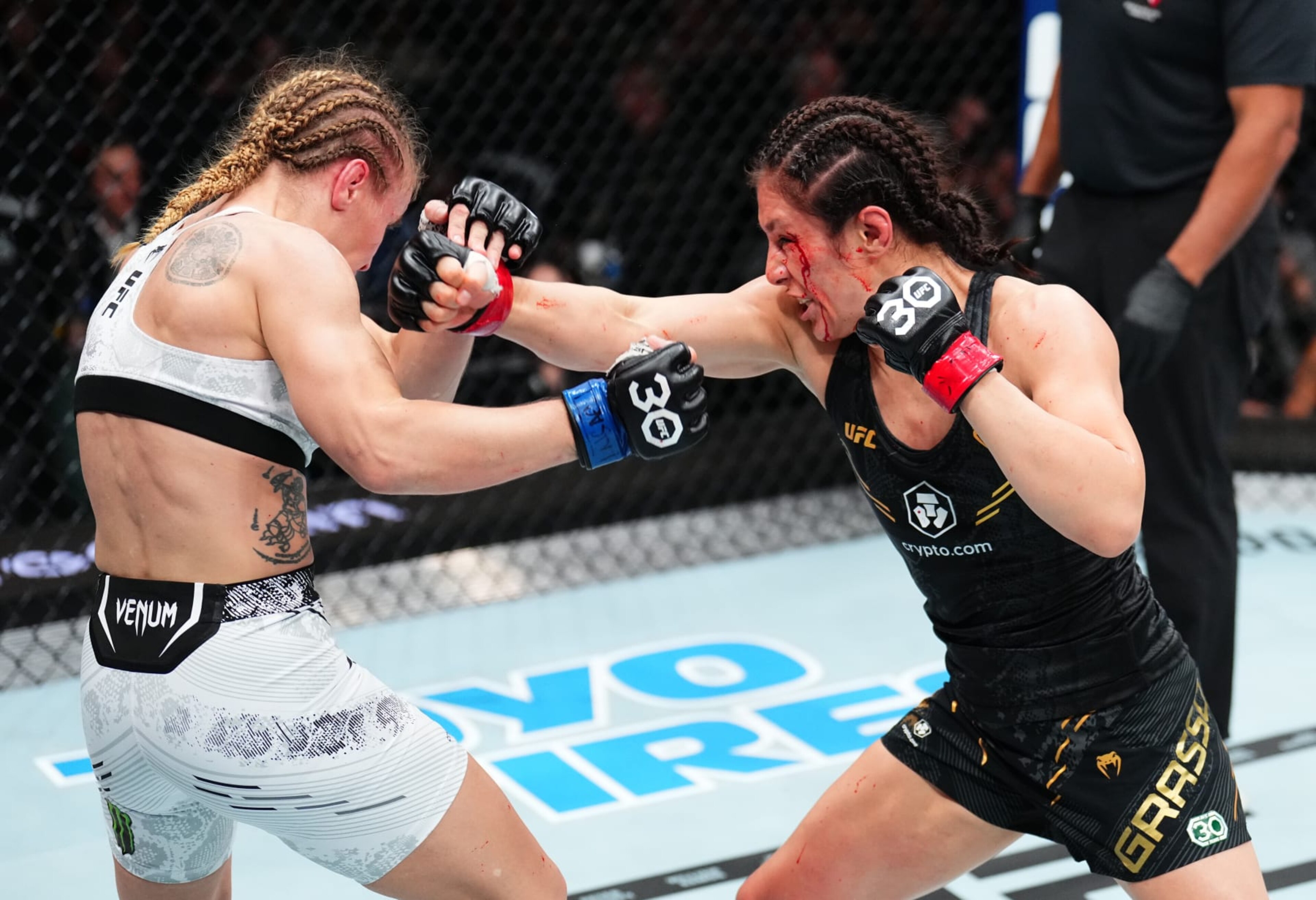 LAS VEGAS, NEVADA - SEPTEMBER 16: (R-L) Alexa Grasso of Mexico punches Valentina Shevchenko of Kyrgyzstan in the UFC flyweight championship fight during the Noche UFC event at T-Mobile Arena on September 16, 2023 in Las Vegas, Nevada. (Photo by Chris Unger/Zuffa LLC via Getty Images)