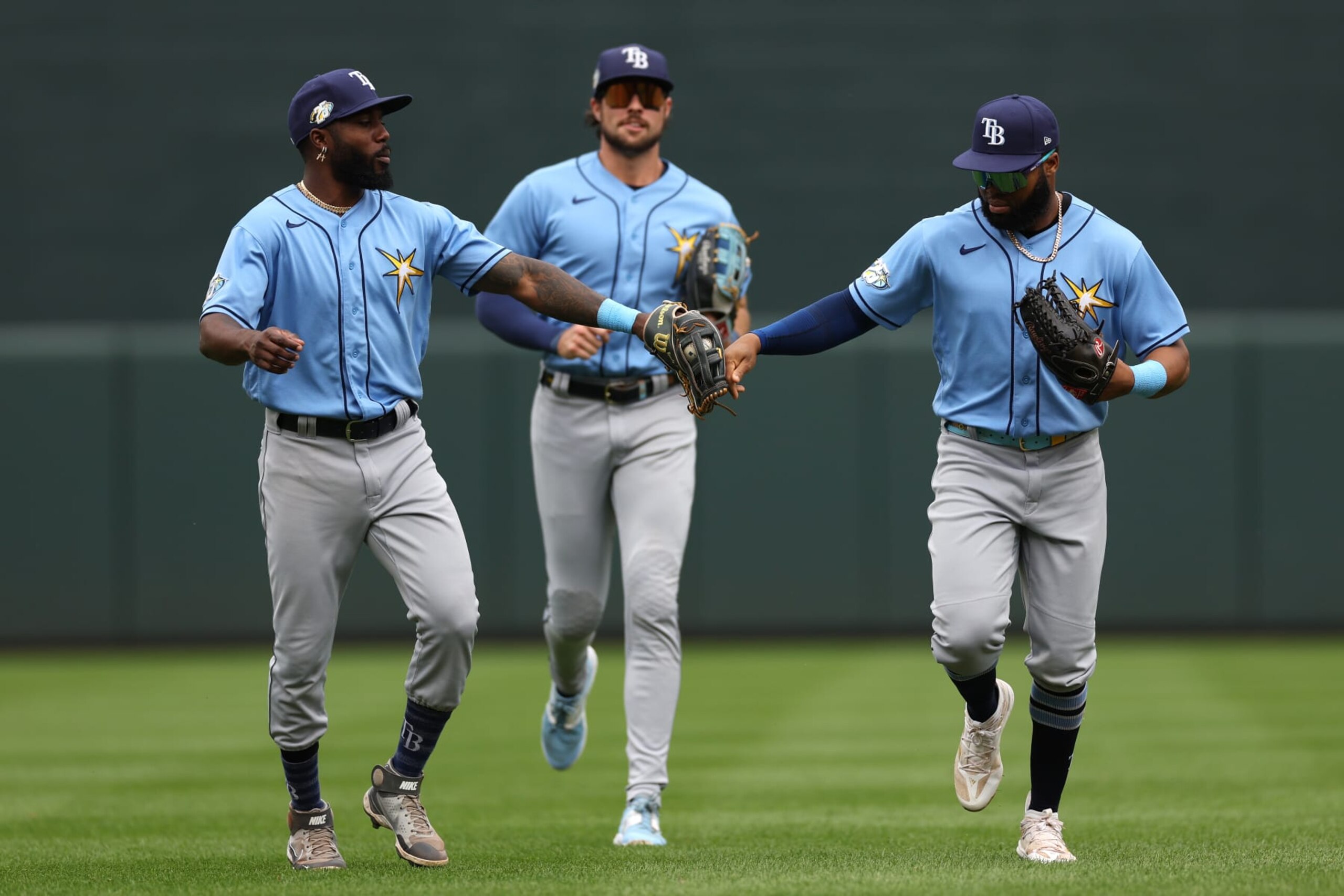 BALTIMORE, MARYLAND - SEPTEMBER 17: Manuel Margot #13 of the Tampa Bay Rays celebrates with teammate Randy Arozarena #56 after making a catch on a hit by the Baltimore Orioles during the second inning at Oriole Park at Camden Yards on September 17, 2023 in Baltimore, Maryland. (Photo by Patrick Smith/Getty Images)
