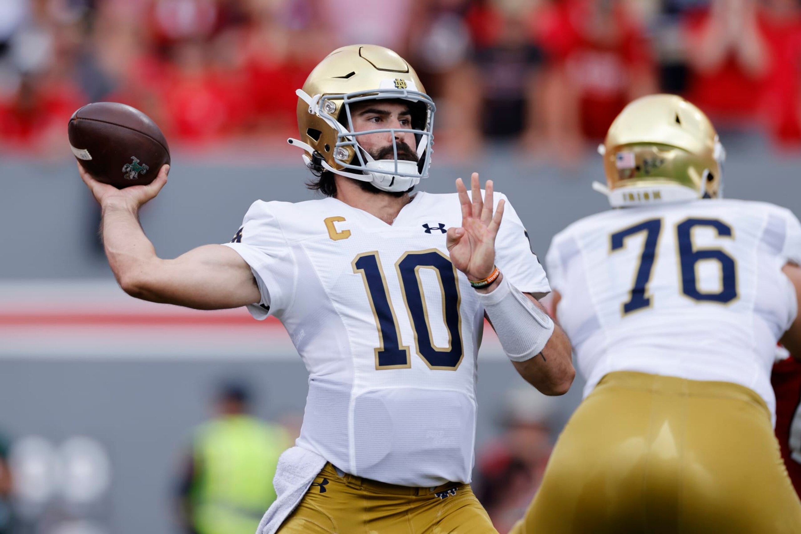 RALEIGH, NC - SEPTEMBER 09: Notre Dame Fighting Irish quarterback Sam Hartman (10) passes the ball during a college football game against the North Carolina State Wolfpack on September 09, 2023 at Carter-Finley Stadium in Raleigh, North Carolina. (Photo by Joe Robbins/Icon Sportswire via Getty Images) RALEIGH, NC - SEPTEMBER 09: Notre Dame Fighting Irish quarterback Sam Hartman (10) passes the ball during a college football game against the North Carolina State Wolfpack on September 09, 2023 at Carter-Finley Stadium in Raleigh, North Carolina. (Photo by Joe Robbins/Icon Sportswire via Getty Images)