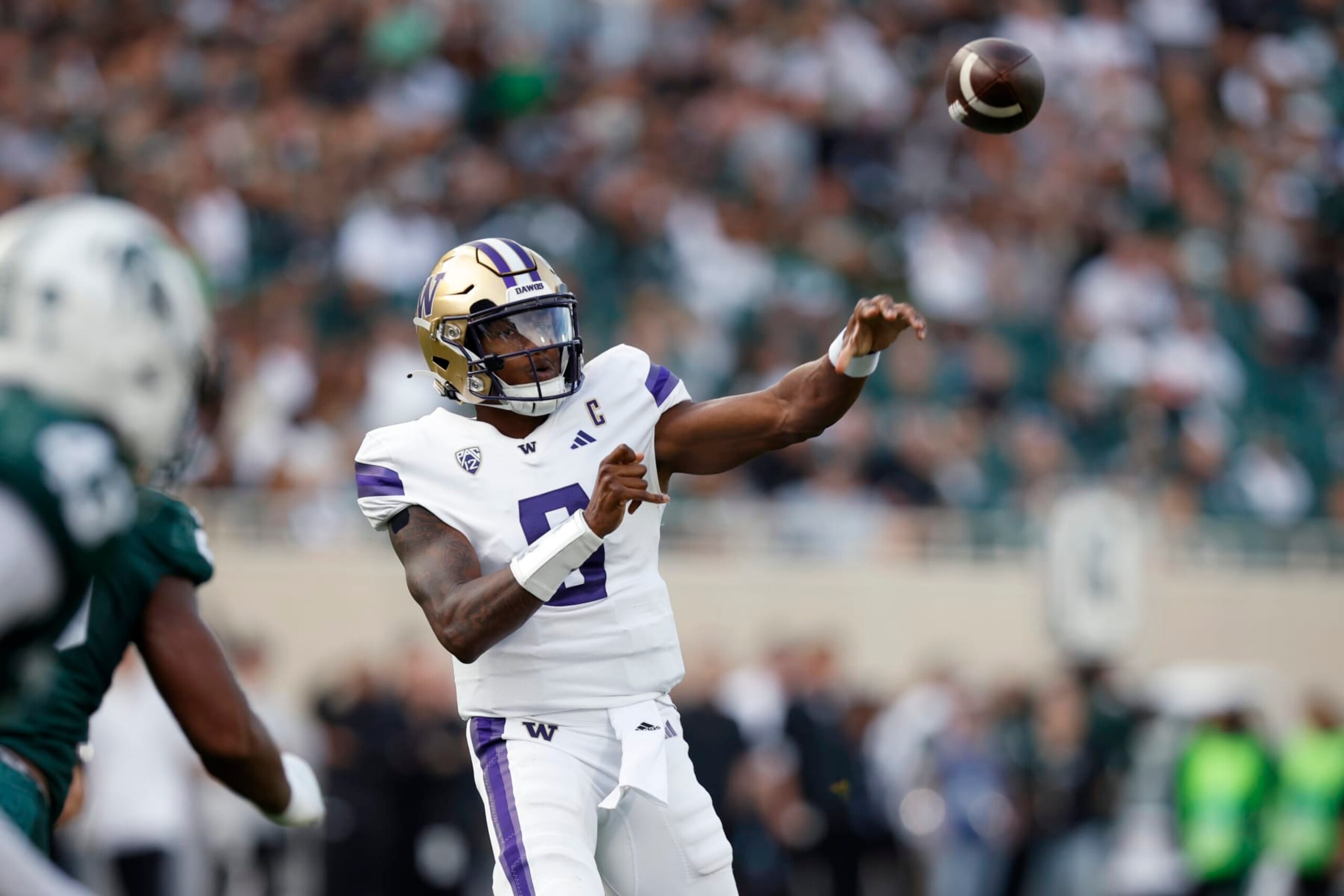 Washington's Michael Penix Jr. throws a pass against Michigan State during the first half of an NCAA college football game, Saturday, Sept. 16, 2023, in East Lansing, Mich. Washington won 41-7. (AP Photo/Al Goldis) Washington's Michael Penix Jr. throws a pass against Michigan State during the first half of an NCAA college football game, Saturday, Sept. 16, 2023, in East Lansing, Mich. Washington won 41-7. (AP Photo/Al Goldis)