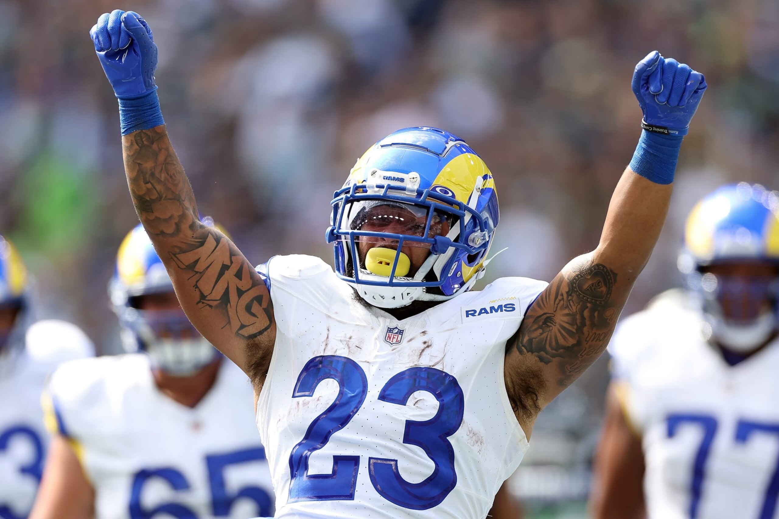 SEATTLE, WASHINGTON - SEPTEMBER 10:  Kyren Williams #23 of the Los Angeles Rams celebrates after running the ball for a touchdown against the Seattle Seahawks during the first half at Lumen Field on September 10, 2023 in Seattle, Washington. (Photo by Steph Chambers/Getty Images)
