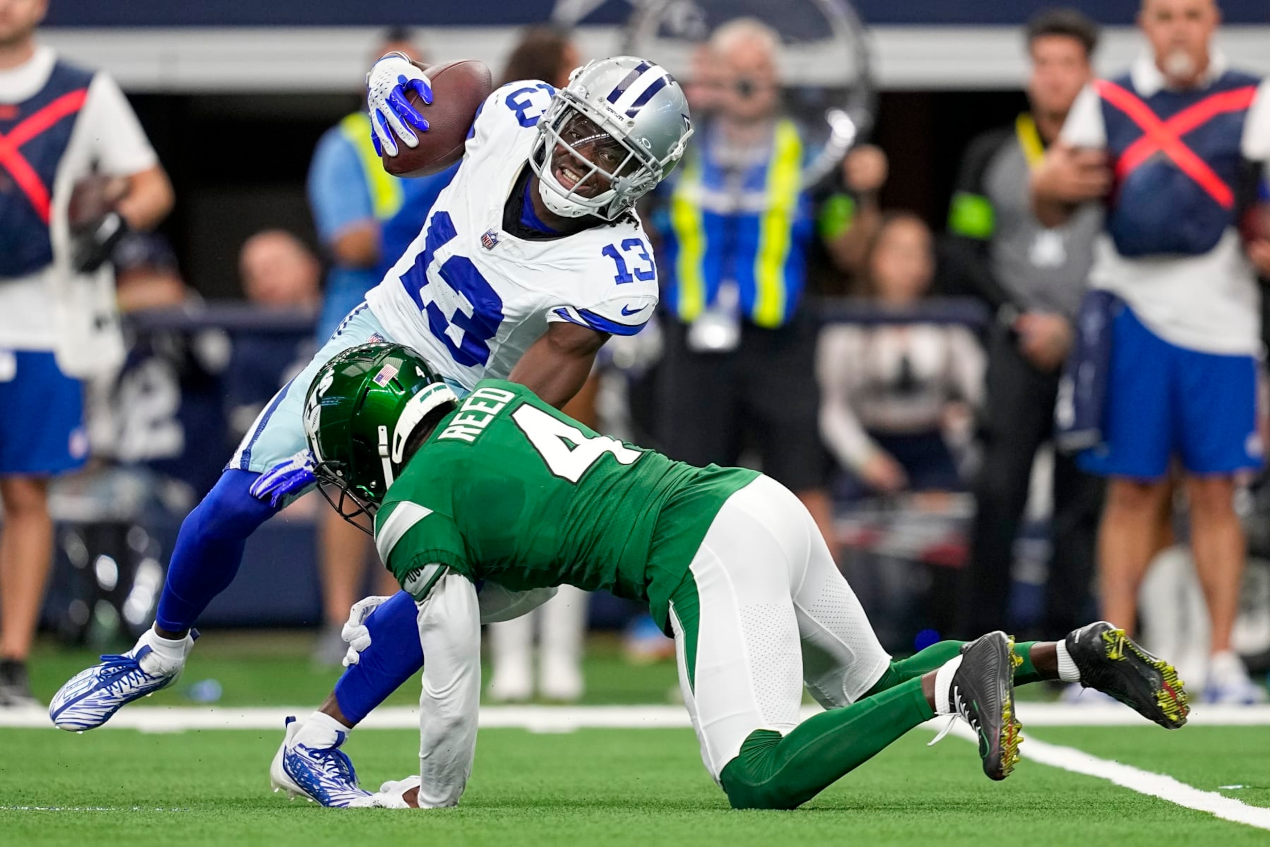 Cowboys WR Michael Gallup is tackled by Jets CB D.J. Reed 
