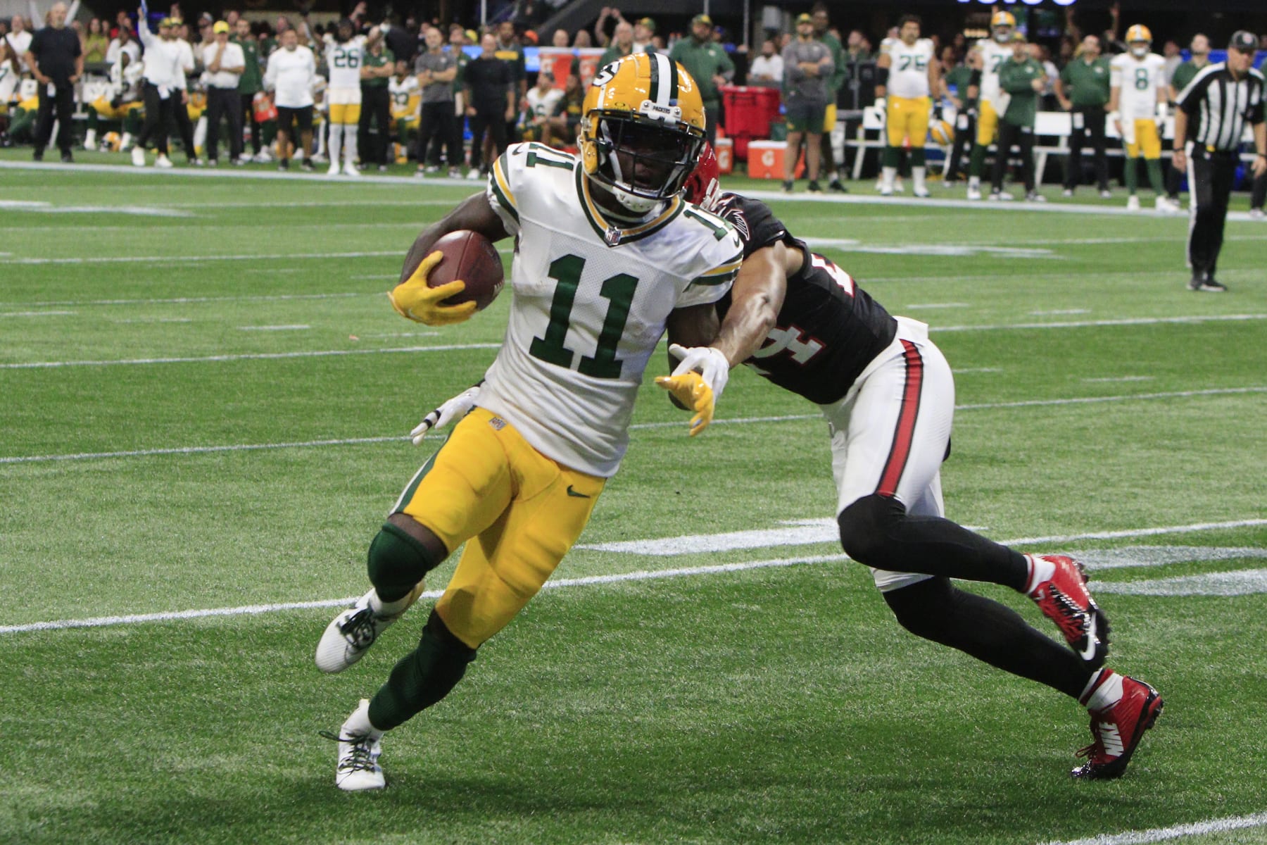 ATLANTA, GA - SEPTEMBER 17: Green Bay Packers wide receiver Jayden Reed #11 attempts to score during the NFL game between the Green Bay Packers and the Atlanta Falcons on September 17, 2023 at Mercedes-Benz Stadium in Atlanta, GA.  (Photo by Jeff Robinson/Icon Sportswire via Getty Images)