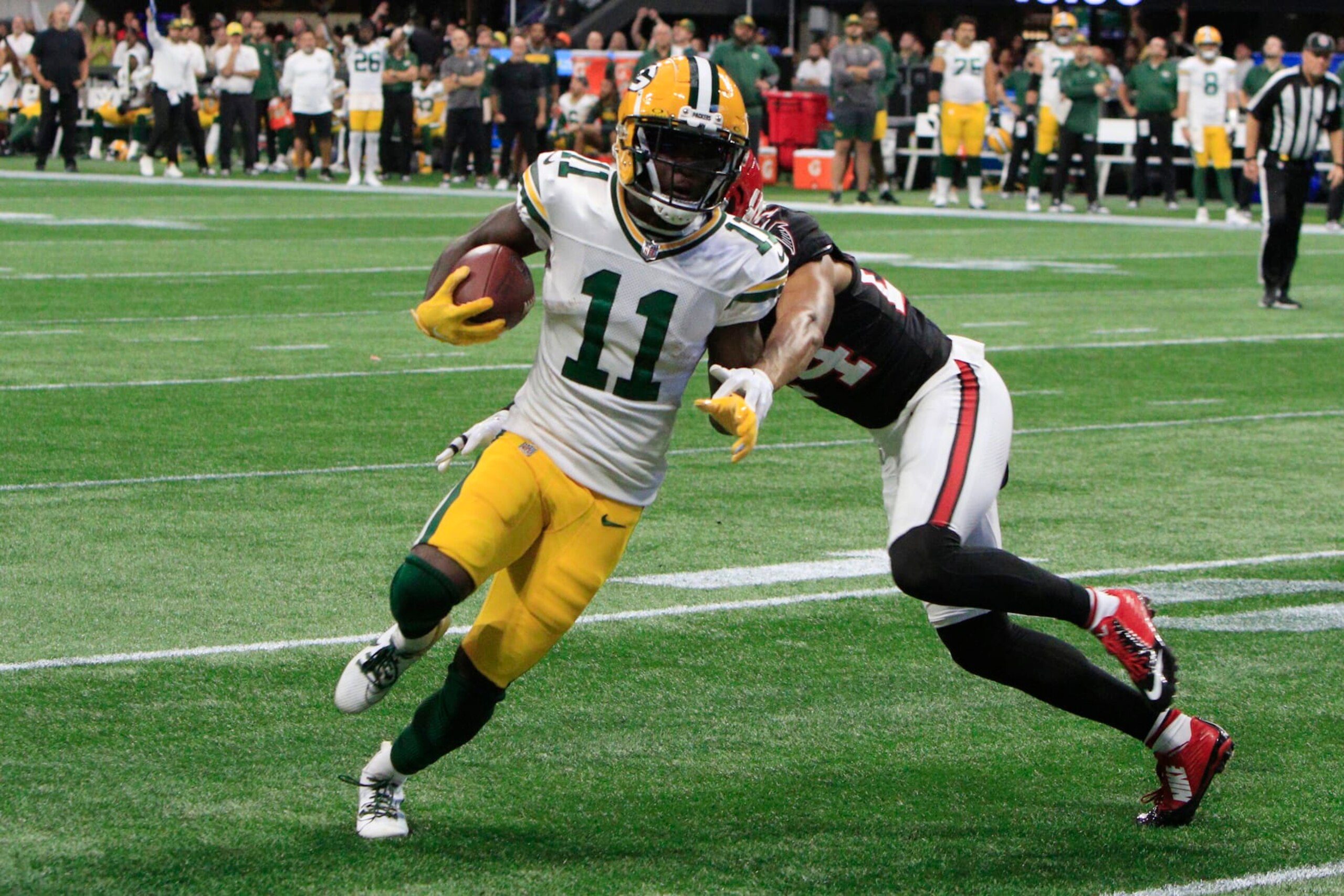 ATLANTA, GA - SEPTEMBER 17: Green Bay Packers wide receiver Jayden Reed #11 attempts to score during the NFL game between the Green Bay Packers and the Atlanta Falcons on September 17, 2023 at Mercedes-Benz Stadium in Atlanta, GA.  (Photo by Jeff Robinson/Icon Sportswire via Getty Images)
