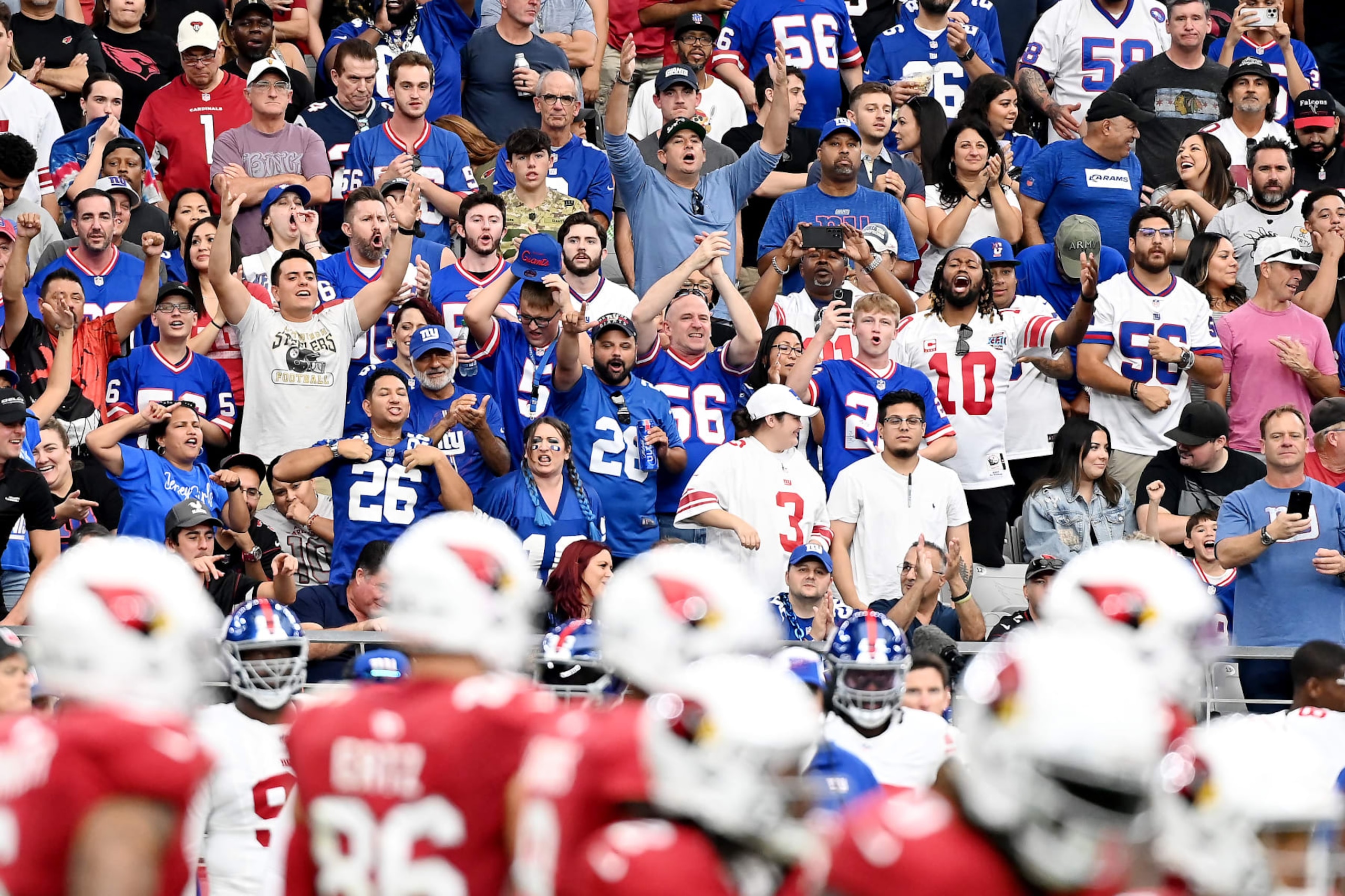 GLENDALE, ARIZONA - SEPTEMBER 17: New York Giants cheer after a touchdown during the third quarter at State Farm Stadium on September 17, 2023 in Glendale, Arizona. (Photo by Norm Hall/Getty Images)