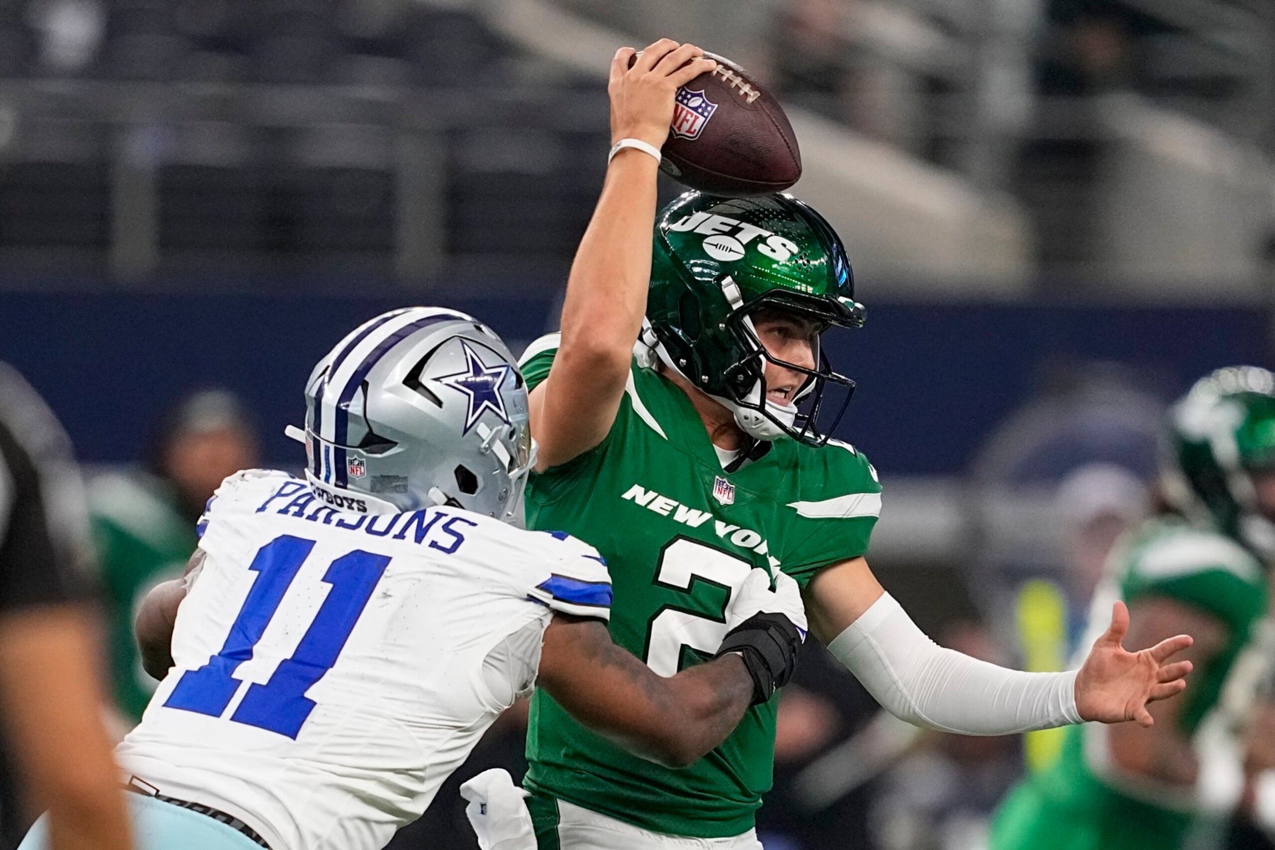 New York Jets quarterback Zach Wilson is sacked by Dallas Cowboys linebacker Micah Parsons during the second half of an NFL football game in Arlington, Texas, Sunday, Aug. 17, 2023. (AP Photo/Tony Gutierrez)