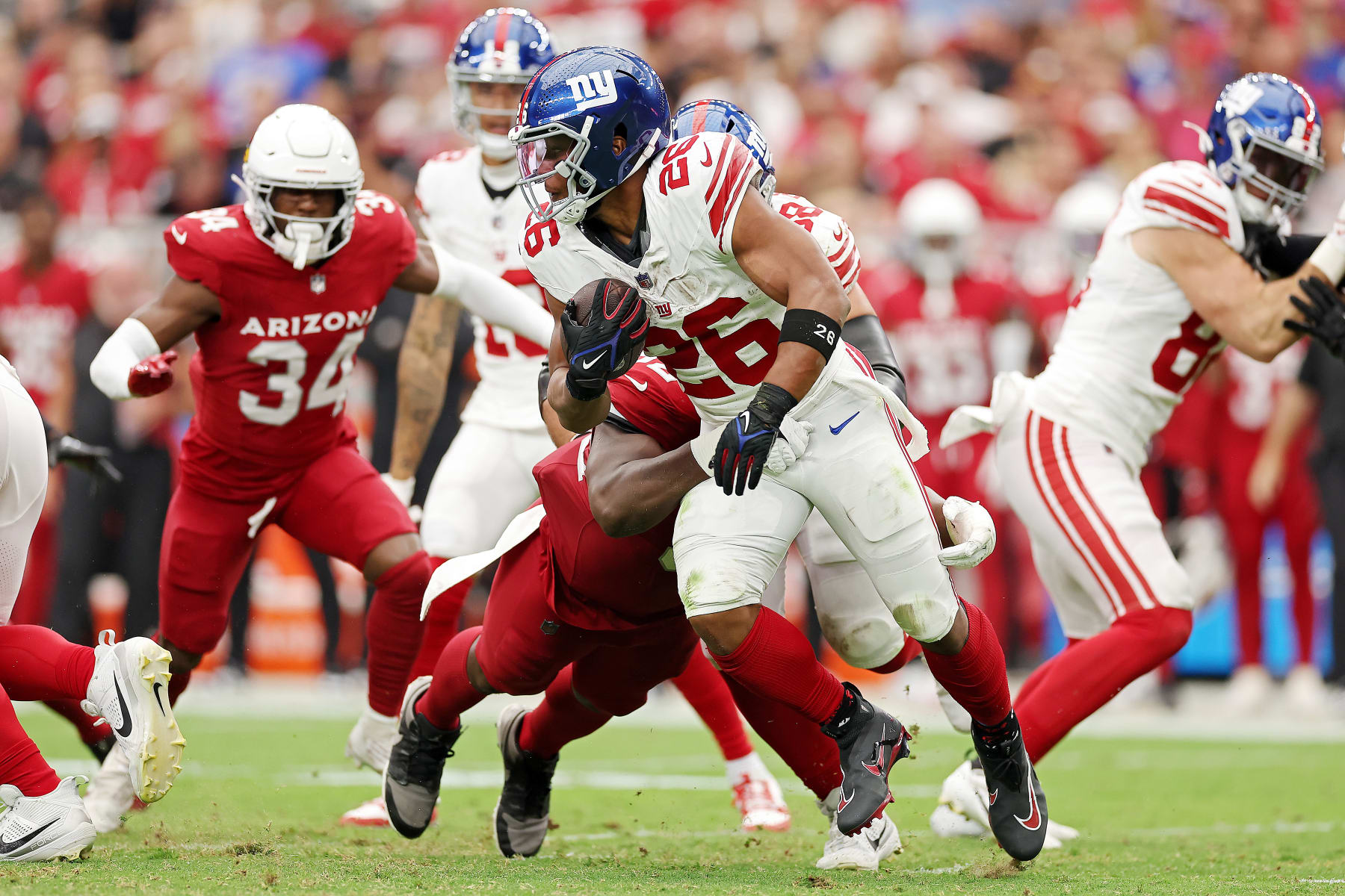 GLENDALE, ARIZONA - SEPTEMBER 17: Saquon Barkley #26 of the New York Giants runs the ball during the second quarter in the game against the Arizona Cardinals at State Farm Stadium on September 17, 2023 in Glendale, Arizona. (Photo by Christian Petersen/Getty Images)