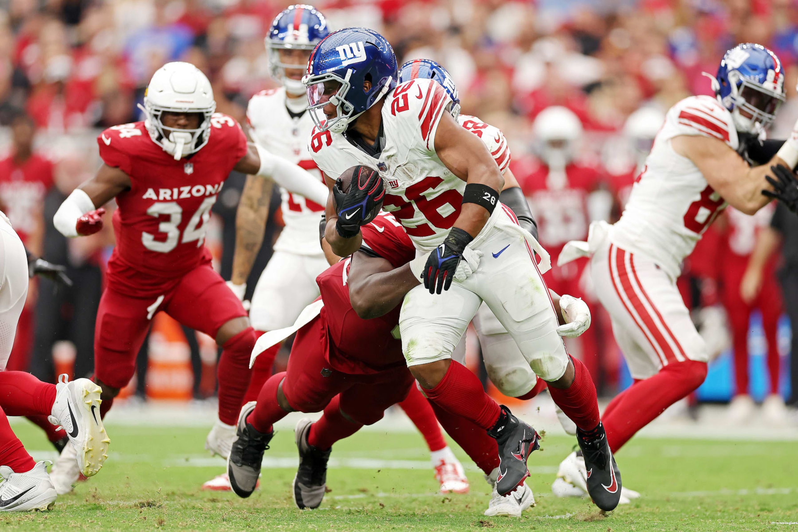 GLENDALE, ARIZONA - SEPTEMBER 17: Saquon Barkley #26 of the New York Giants runs the ball during the second quarter in the game against the Arizona Cardinals at State Farm Stadium on September 17, 2023 in Glendale, Arizona. (Photo by Christian Petersen/Getty Images)