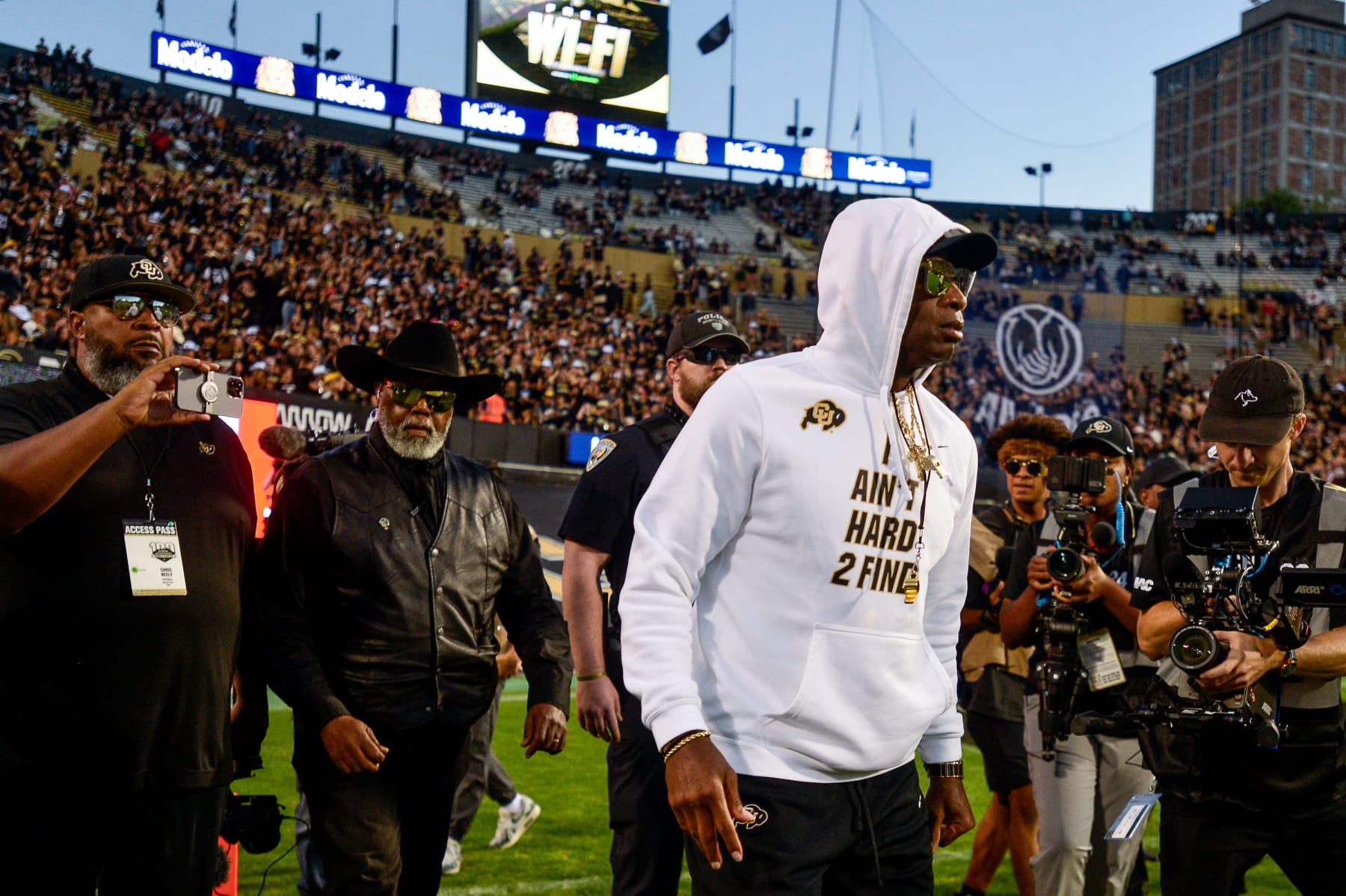 BOULDER, CO - SEPTEMBER 16:  Head coach Deion Sanders of the Colorado Buffaloes walks on the field as players warm up before a game against the Colorado State Rams at Folsom Field on September 16, 2023 in Boulder, Colorado. (Photo by Dustin Bradford/Getty Images)