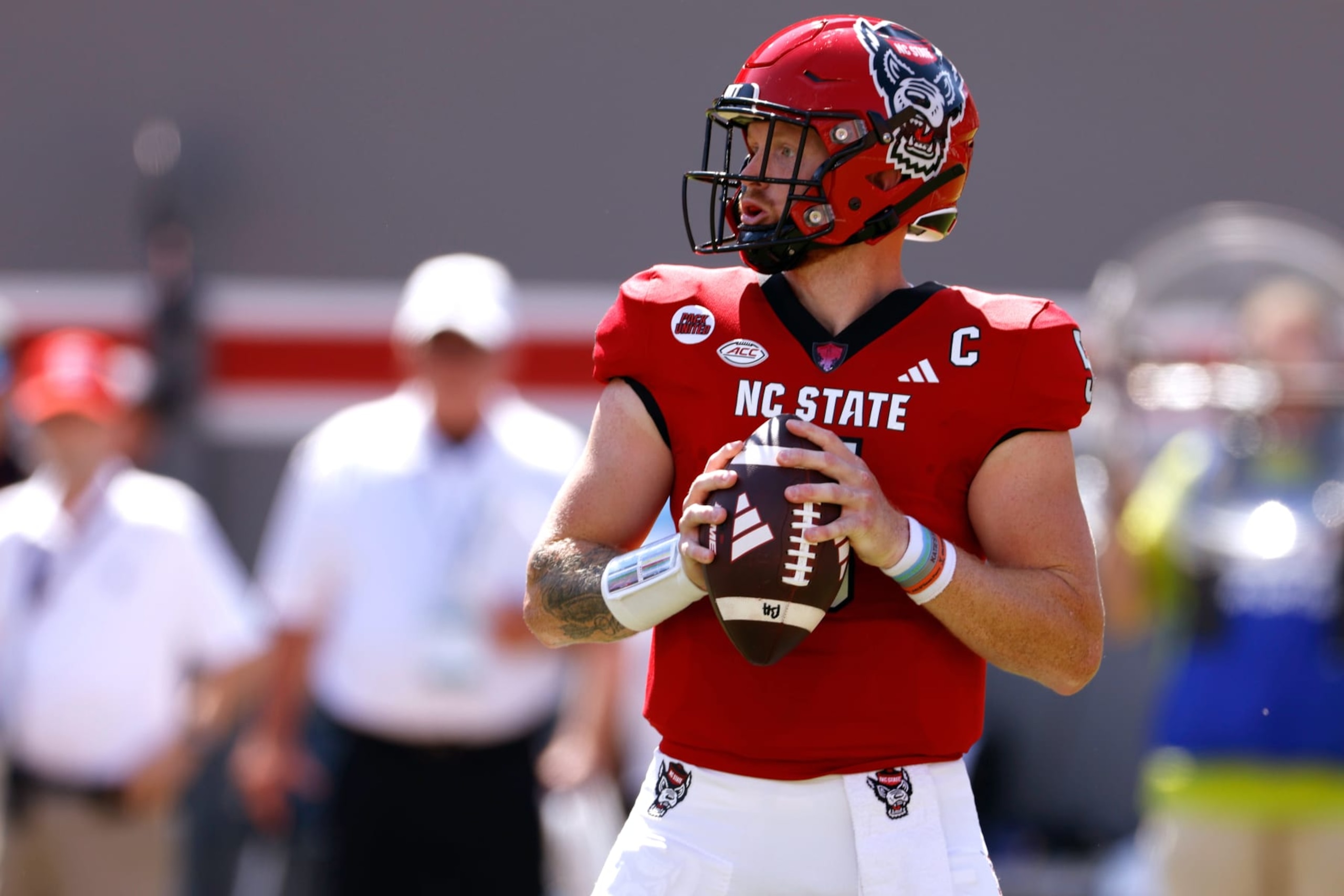 RALEIGH, NORTH CAROLINA - SEPTEMBER 16: Brennan Armstrong #5 of the NC State Wolfpack drops back to pass against the VMI Keydets during the first half at Carter-Finley Stadium on September 16, 2023 in Raleigh, North Carolina. (Photo by Lance King/Getty Images) RALEIGH, NORTH CAROLINA - SEPTEMBER 16: Brennan Armstrong #5 of the NC State Wolfpack drops back to pass against the VMI Keydets during the first half at Carter-Finley Stadium on September 16, 2023 in Raleigh, North Carolina. (Photo by Lance King/Getty Images)