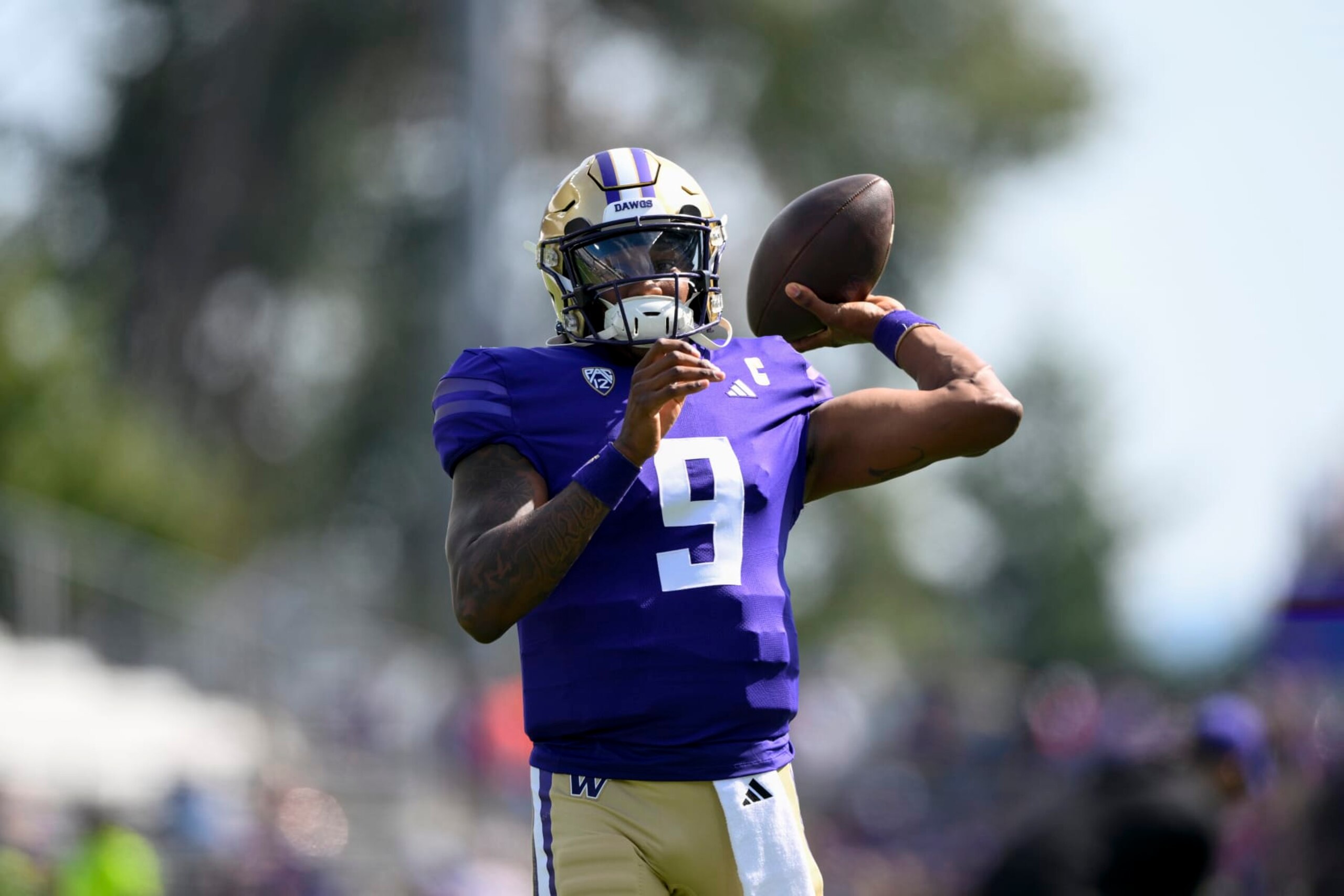 SEATTLE, WASHINGTON - SEPTEMBER 02: Michael Penix Jr. #9 of the Washington Huskies warms up before the game against the Boise State Broncos at Husky Stadium on September 02, 2023 in Seattle, Washington. (Photo by Alika Jenner/Getty Images)