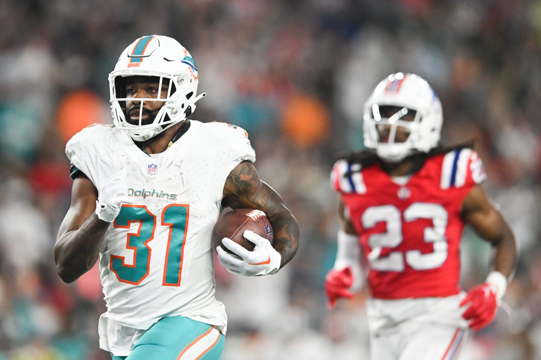 FOXBORO, MA - SEPTEMBER 17: Raheem Mostert #31 of the Miami Dolphins scores a touchdown in the fourth quarter against the New England Patriots at Gillette Stadium on September 17, 2023 in Foxboro, Massachusetts. (Photo by Kathryn Riley/Getty Images)