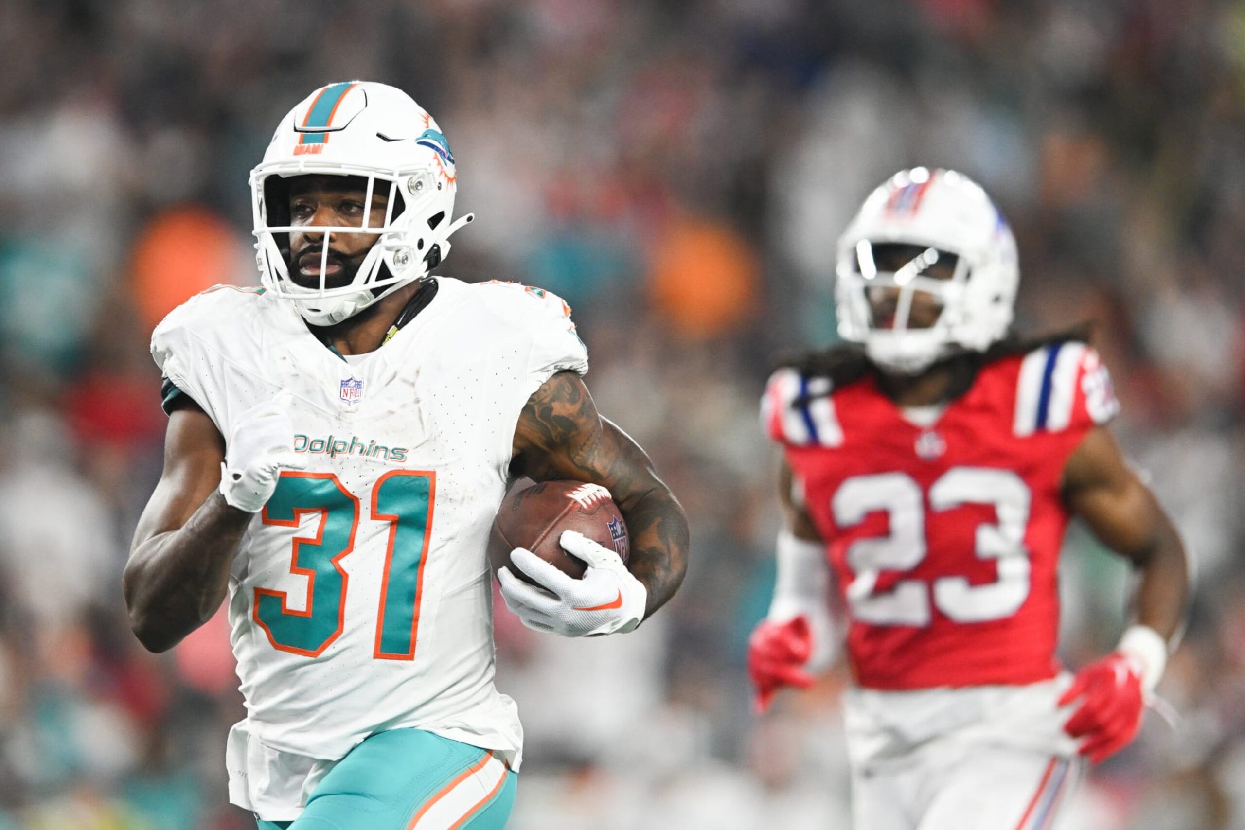 FOXBORO, MA - SEPTEMBER 17: Raheem Mostert #31 of the Miami Dolphins scores a touchdown in the fourth quarter against the New England Patriots at Gillette Stadium on September 17, 2023 in Foxboro, Massachusetts. (Photo by Kathryn Riley/Getty Images) FOXBORO, MA - SEPTEMBER 17: Raheem Mostert #31 of the Miami Dolphins scores a touchdown in the fourth quarter against the New England Patriots at Gillette Stadium on September 17, 2023 in Foxboro, Massachusetts. (Photo by Kathryn Riley/Getty Images)