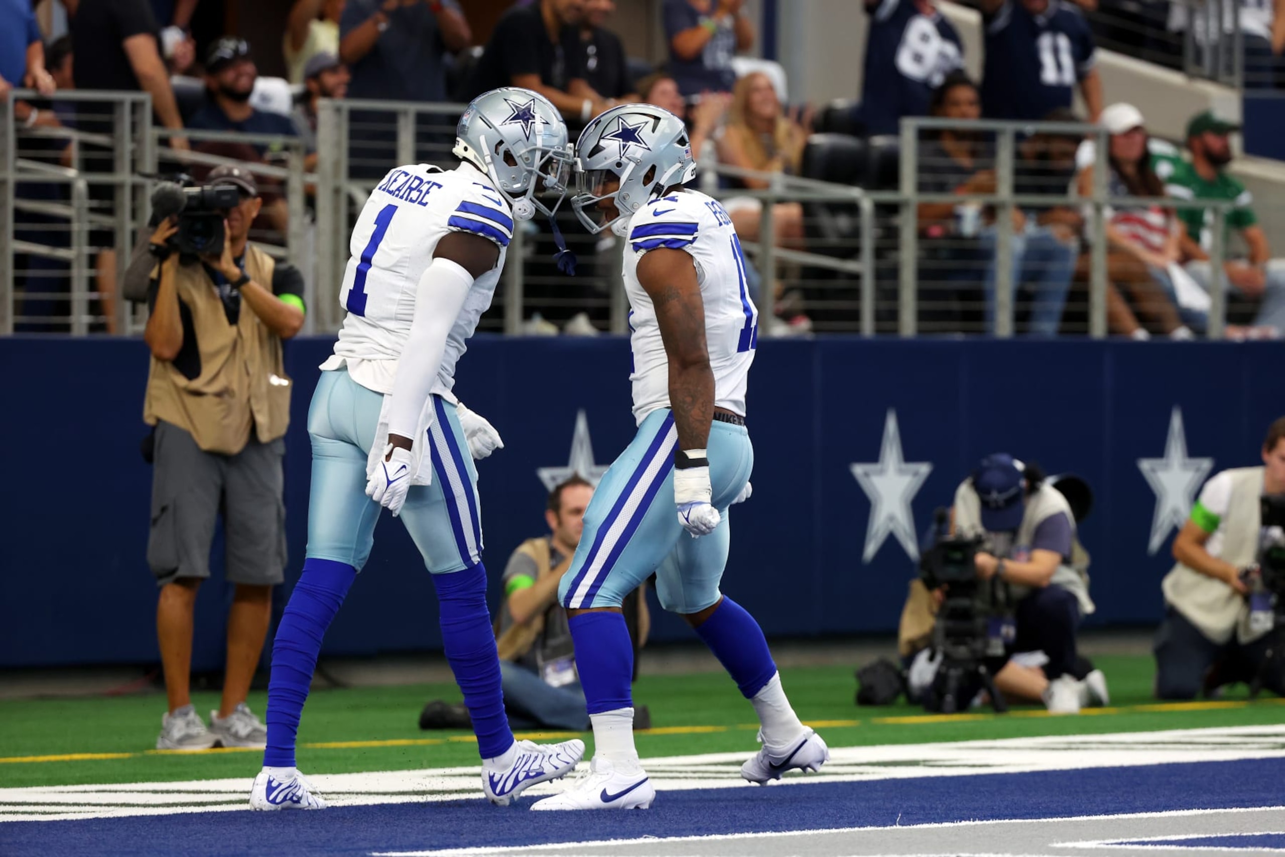 ARLINGTON, TEXAS - SEPTEMBER 17: Jayron Kearse #1 and Micah Parsons #11 of the Dallas Cowboys react after a sack during the first quarter against the New York Jets at AT&T Stadium on September 17, 2023 in Arlington, Texas. (Photo by Richard Rodriguez/Getty Images)