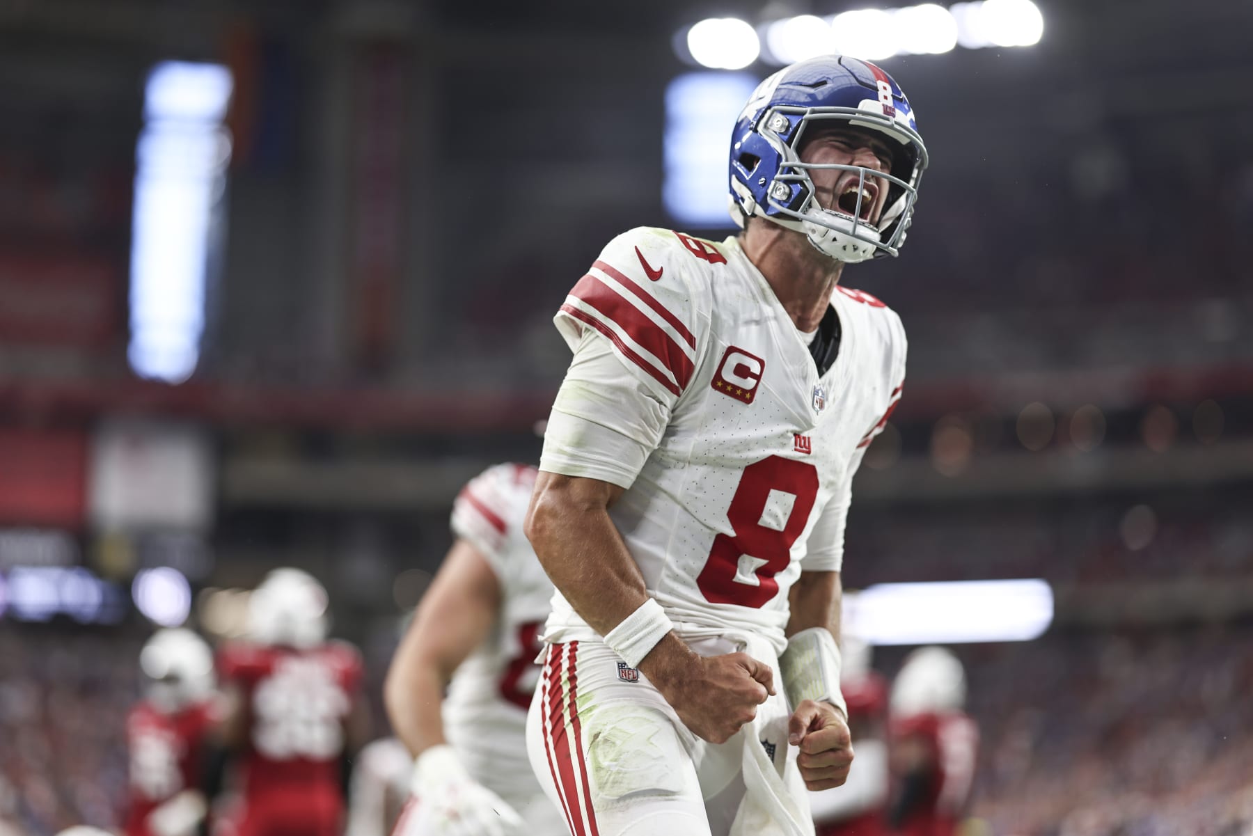 GLENDALE, ARIZONA - SEPTEMBER 17: Daniel Jones #8 of the New York Giants celebrates after running for a touchdown during the fourth quarter of an NFL football game between the Arizona Cardinals and the New York Giants at State Farm Stadium on September 17, 2023 in Glendale, Arizona. (Photo by Michael Owens/Getty Images)