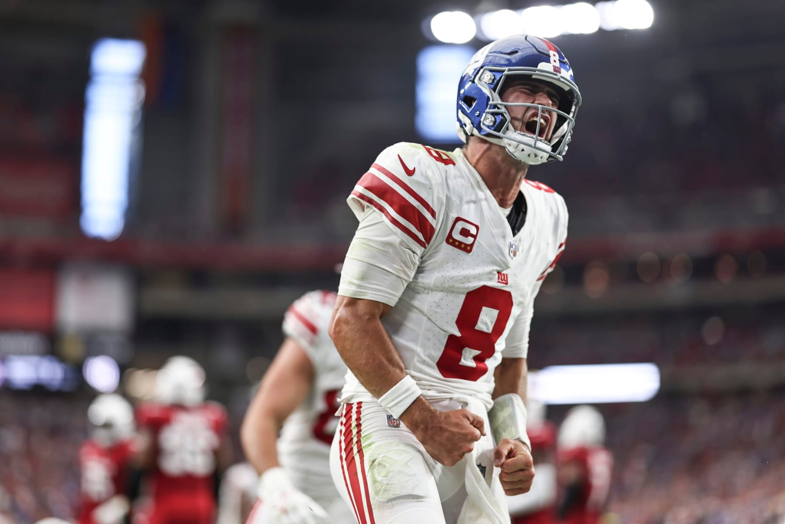 GLENDALE, ARIZONA - SEPTEMBER 17: Daniel Jones #8 of the New York Giants celebrates after running for a touchdown during the fourth quarter of an NFL football game between the Arizona Cardinals and the New York Giants at State Farm Stadium on September 17, 2023 in Glendale, Arizona. (Photo by Michael Owens/Getty Images)